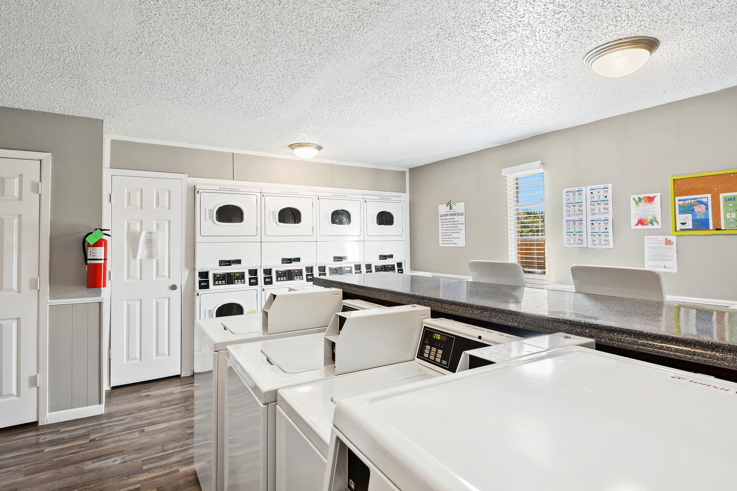 a kitchen with a sink and a mirror