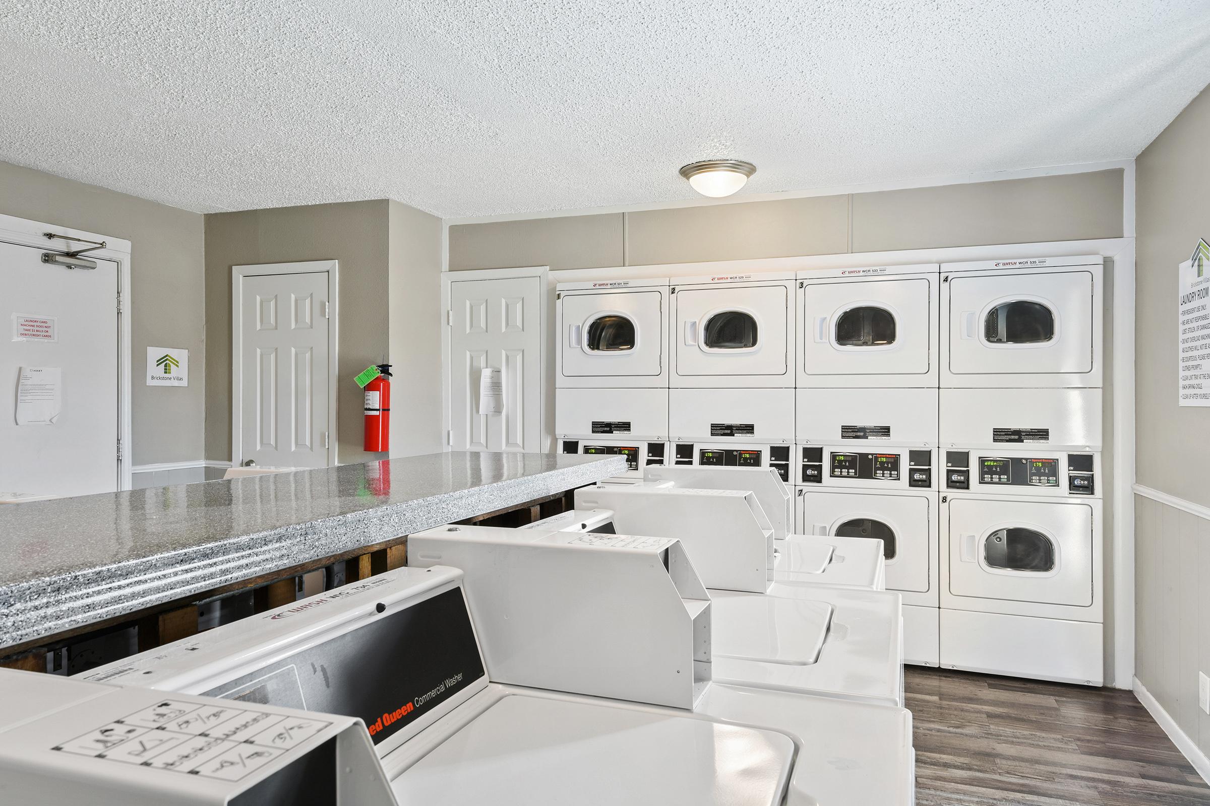 a stove top oven sitting inside of a kitchen