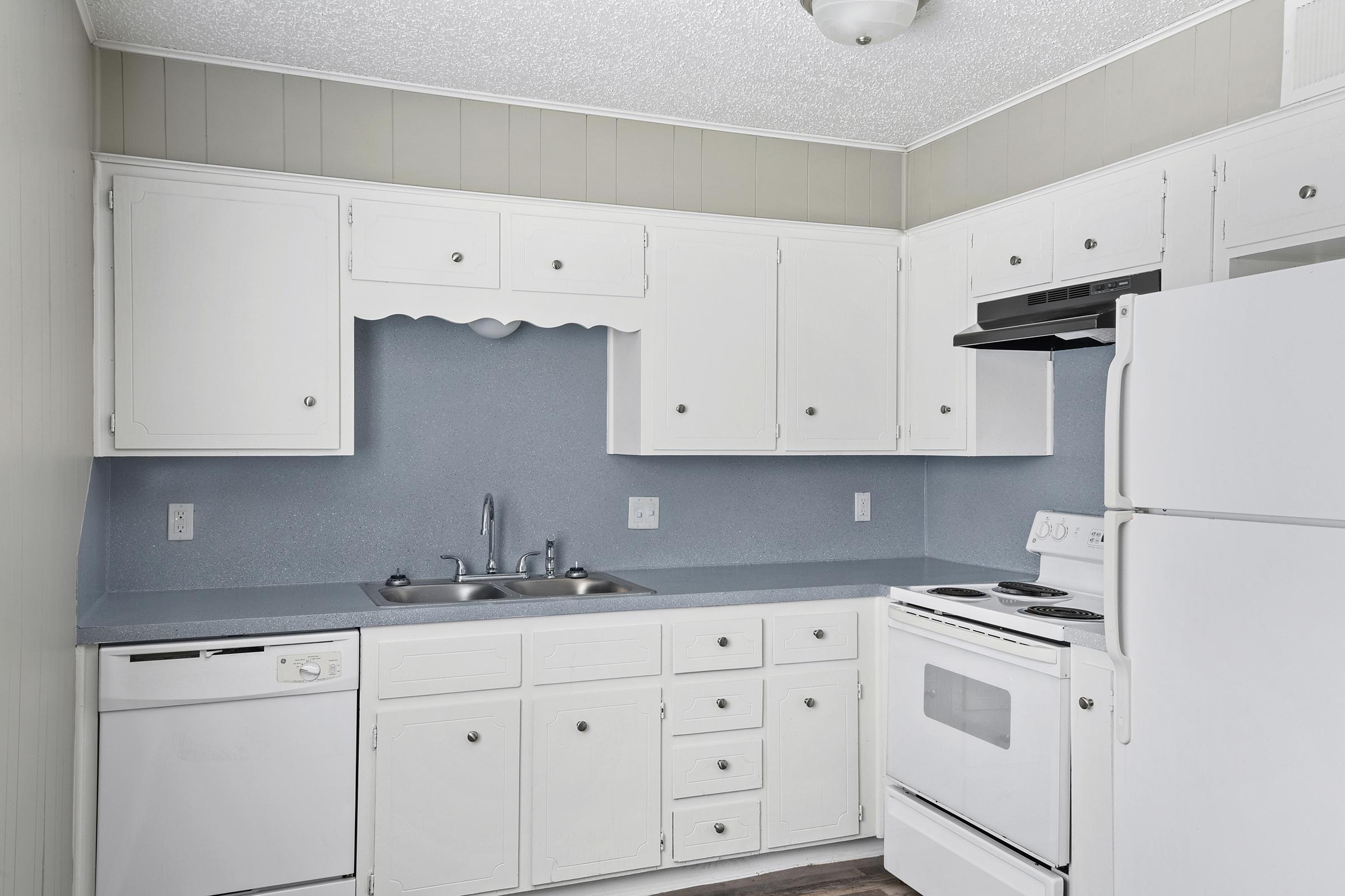 a kitchen with a stove top oven sitting inside of a refrigerator