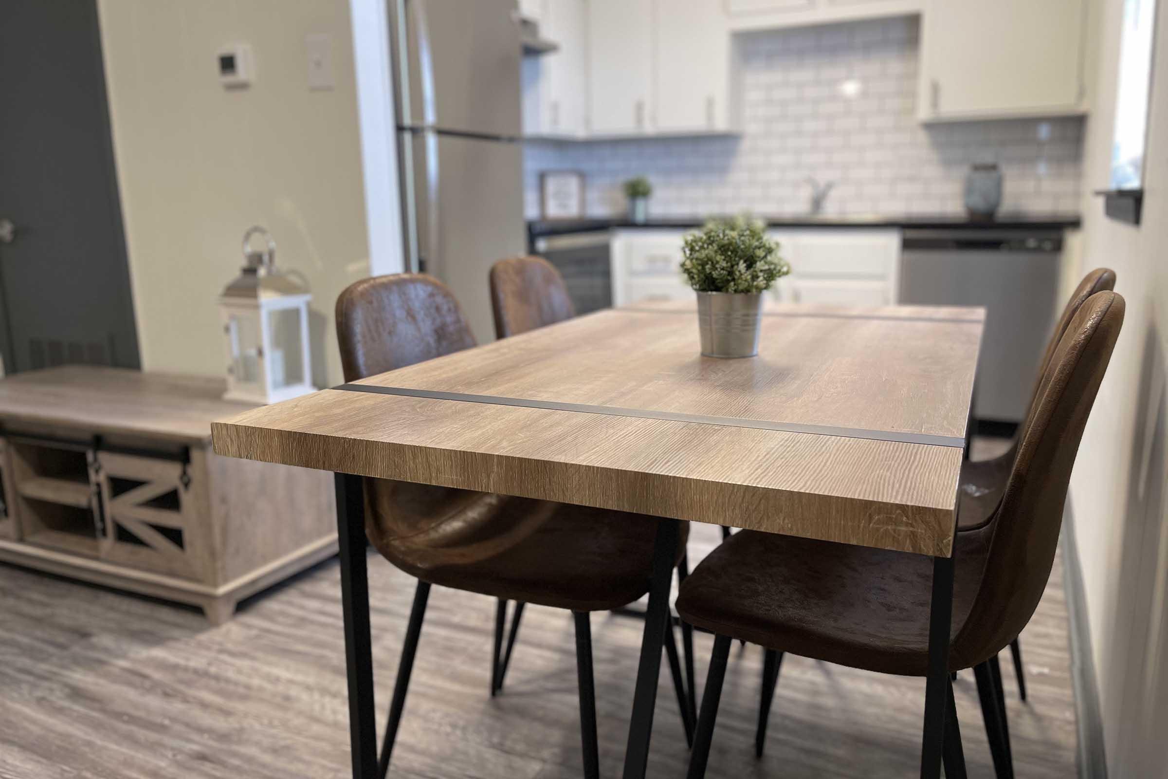 a chair sitting in front of a wooden table