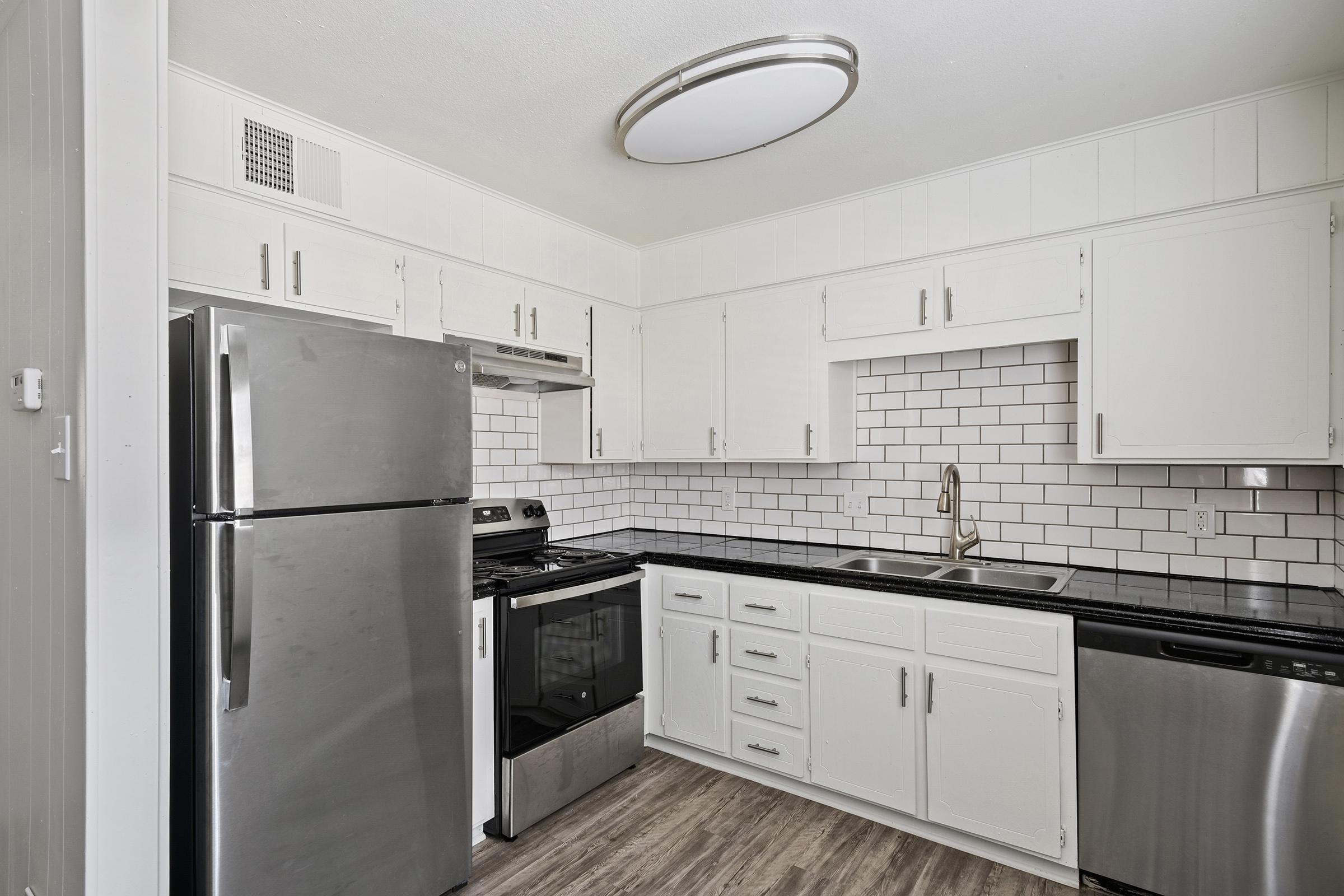 a stainless steel refrigerator in a kitchen