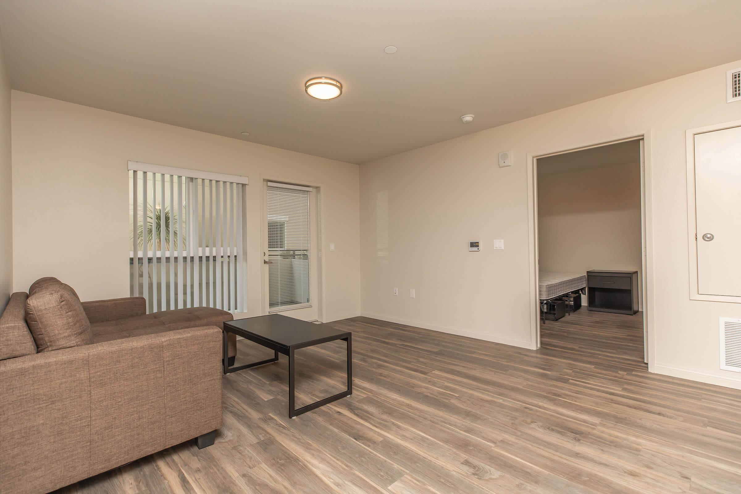 a living room filled with furniture and a flat screen tv