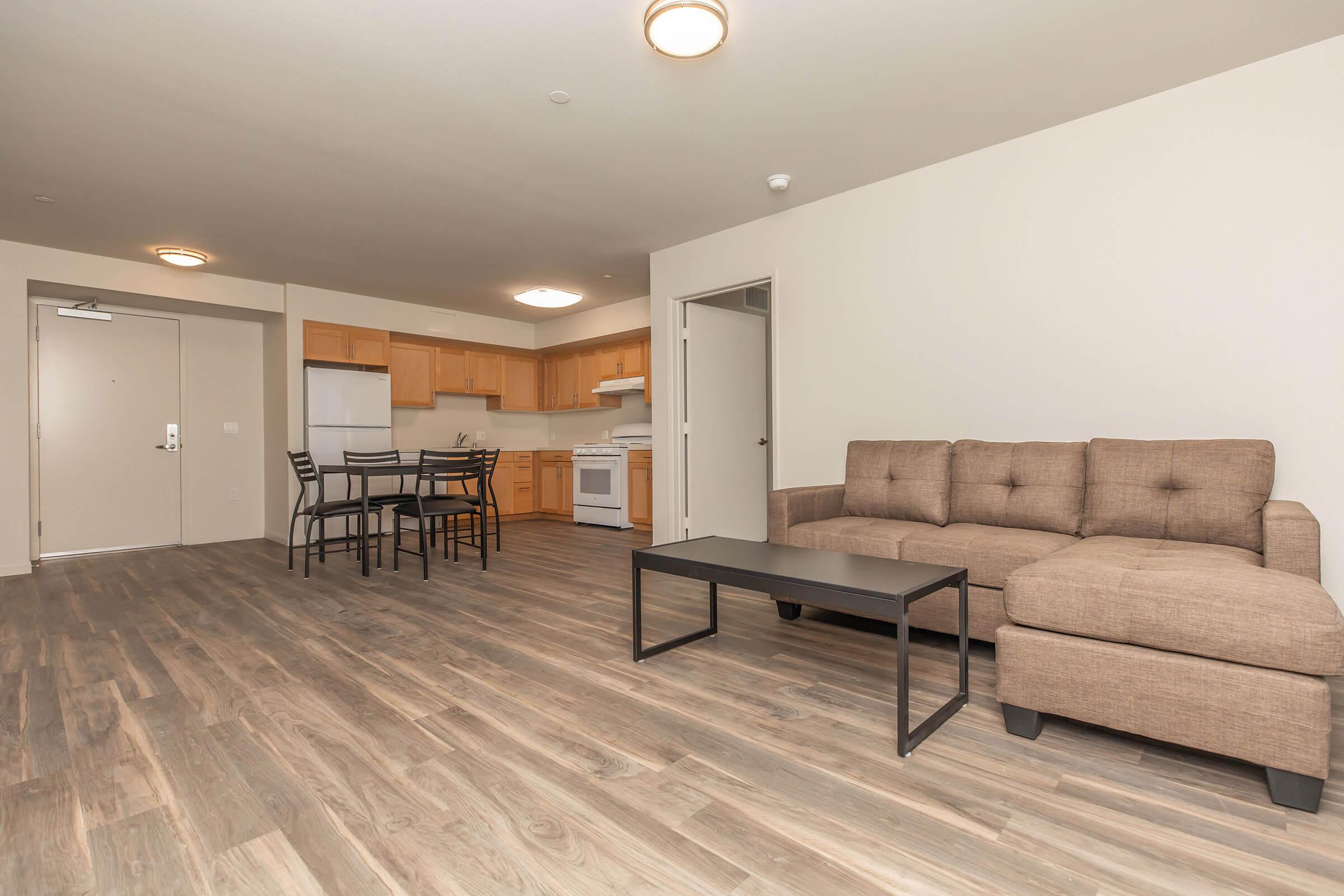 a living room filled with furniture and a flat screen tv