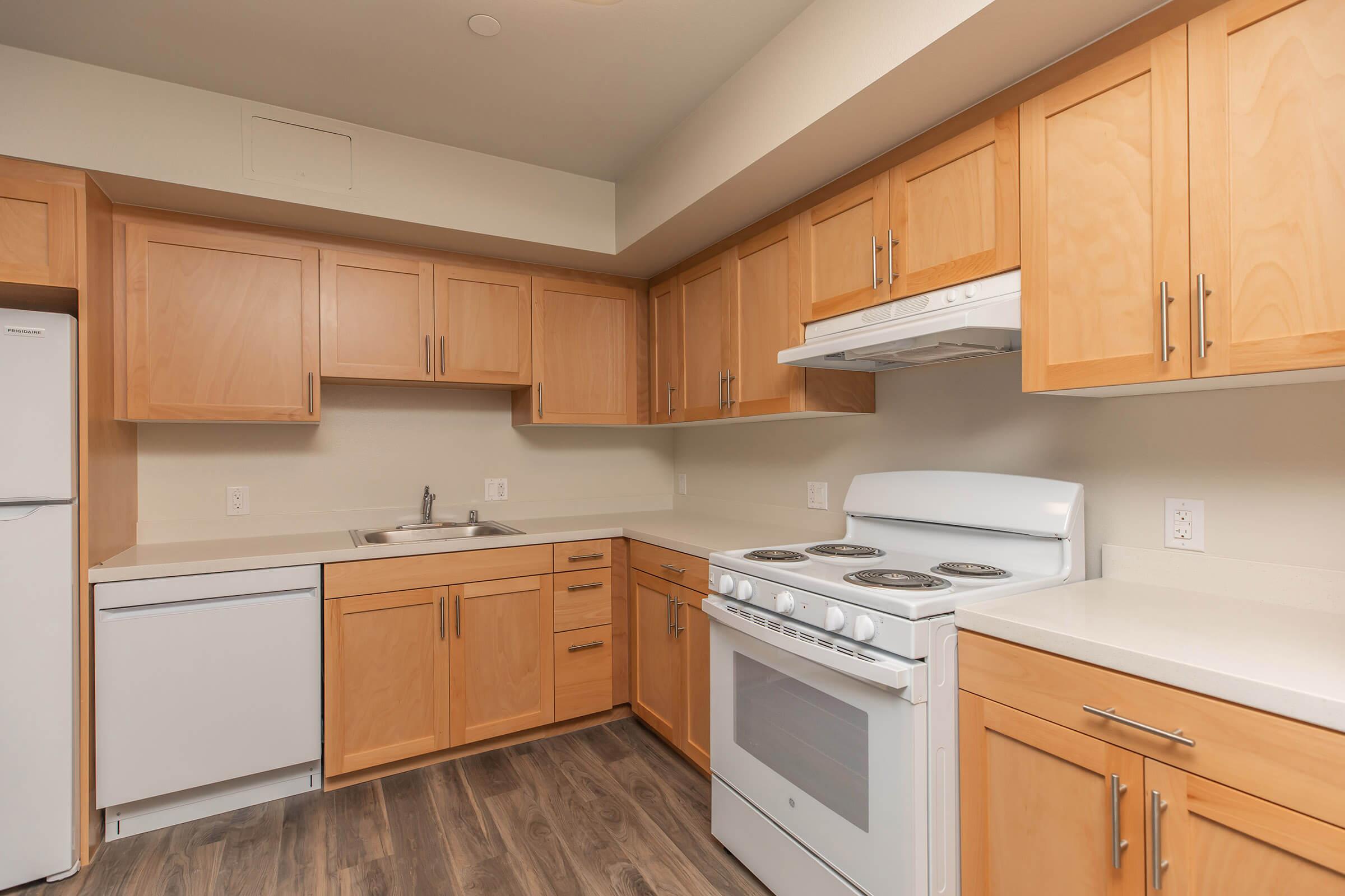 a kitchen with a refrigerator stove and microwave