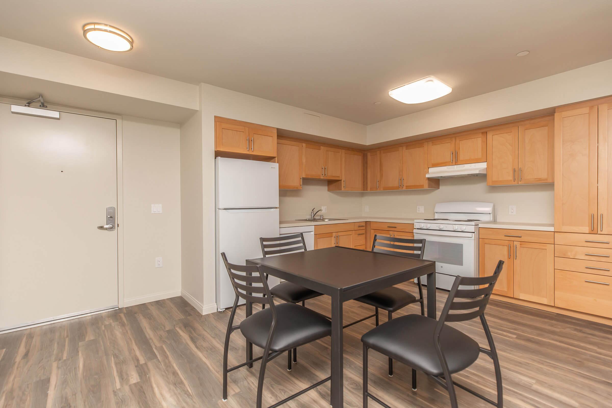 a kitchen with a dining room table