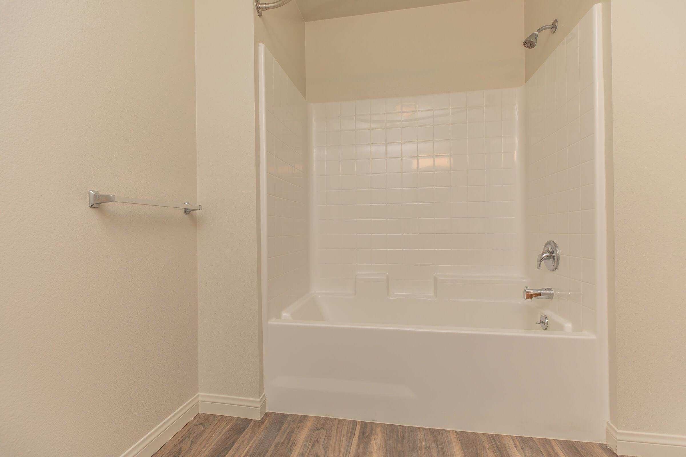 a room with a large tub next to a shower