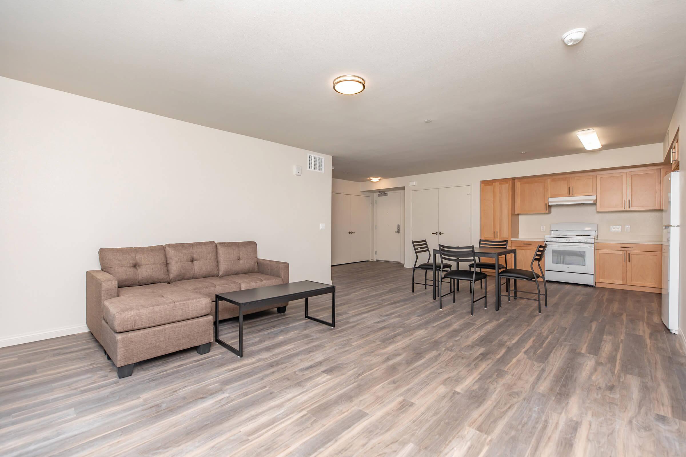 a room filled with furniture and a wood floor