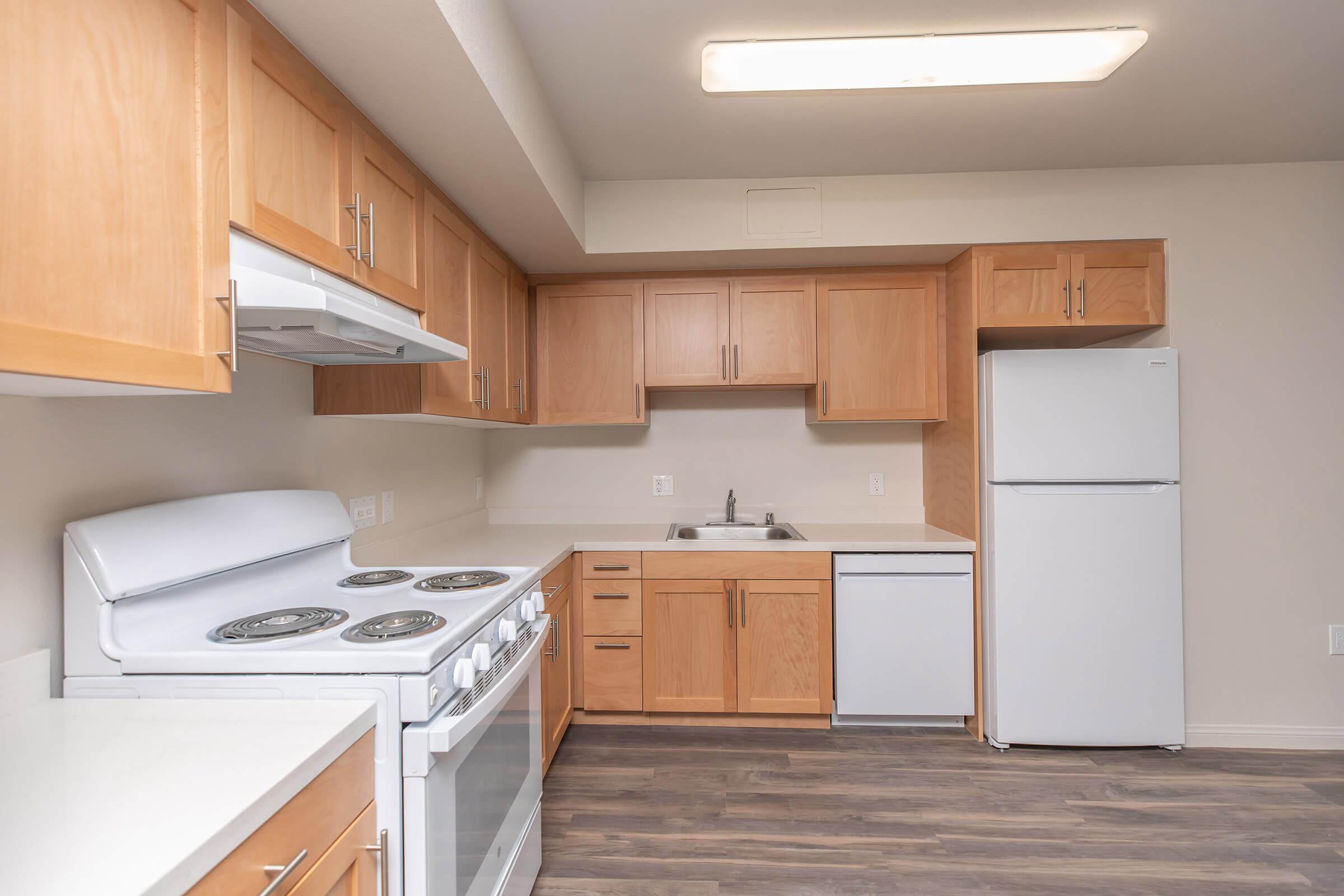 a kitchen with a refrigerator stove and microwave