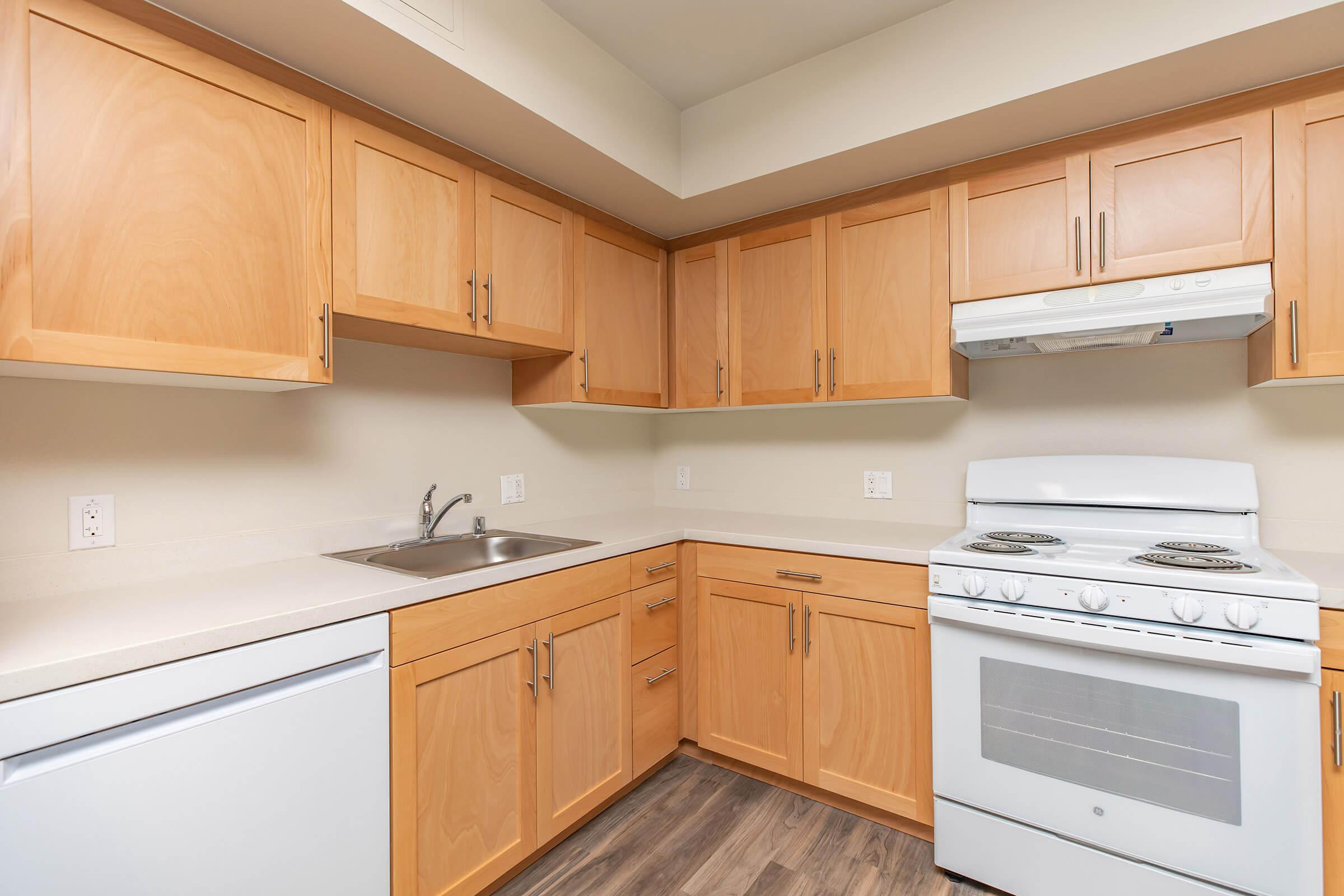 a kitchen with a stove and a microwave