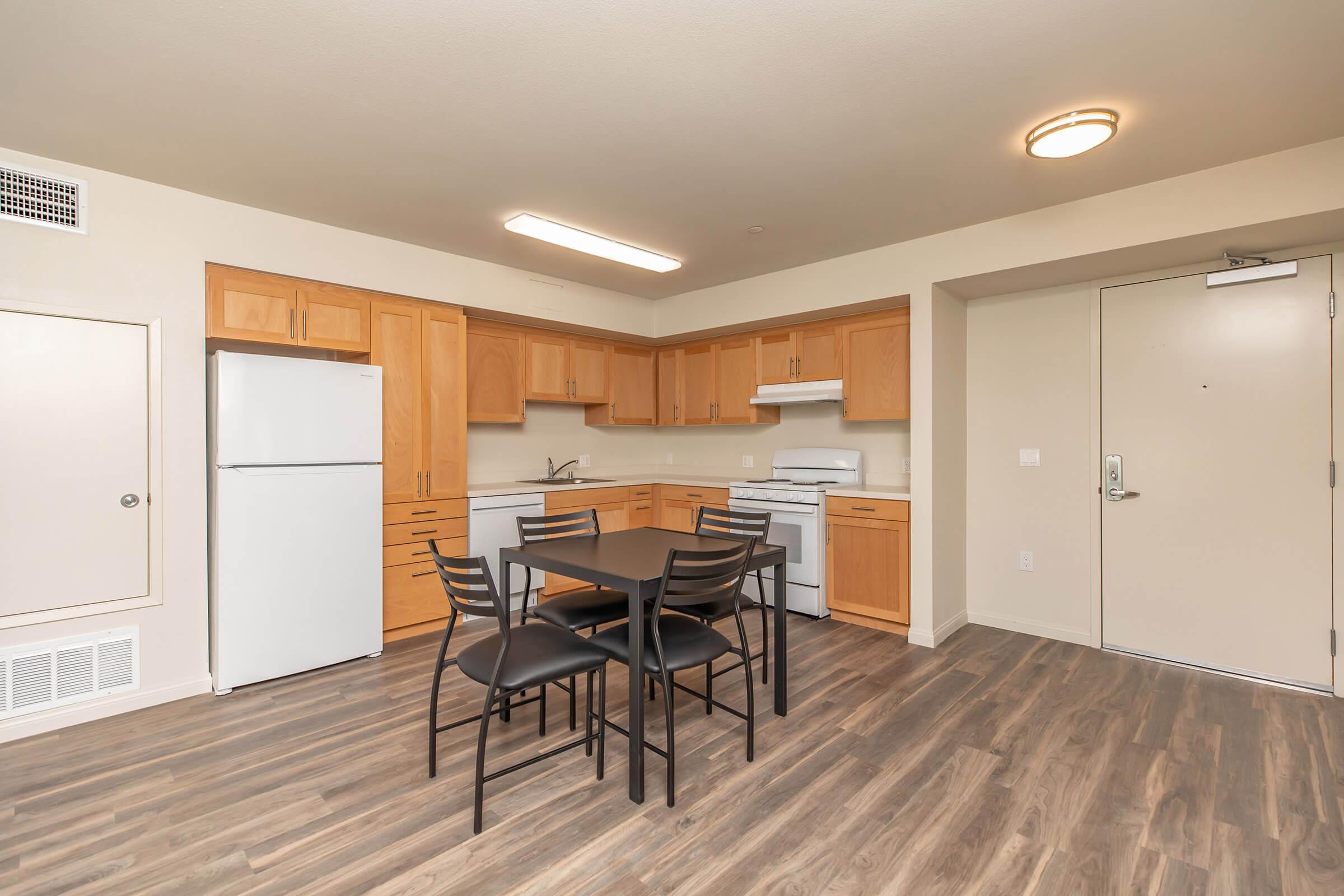 a kitchen with a wooden floor