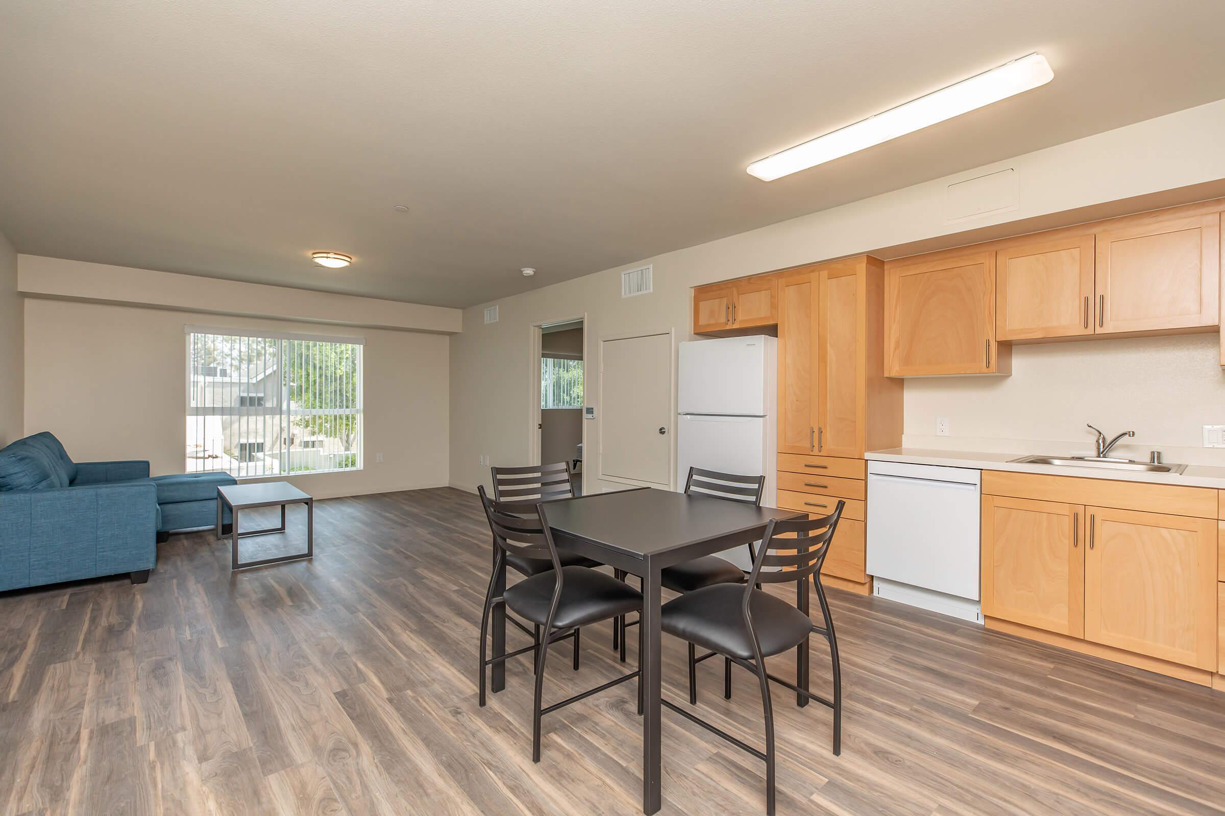 a room filled with furniture and a large window