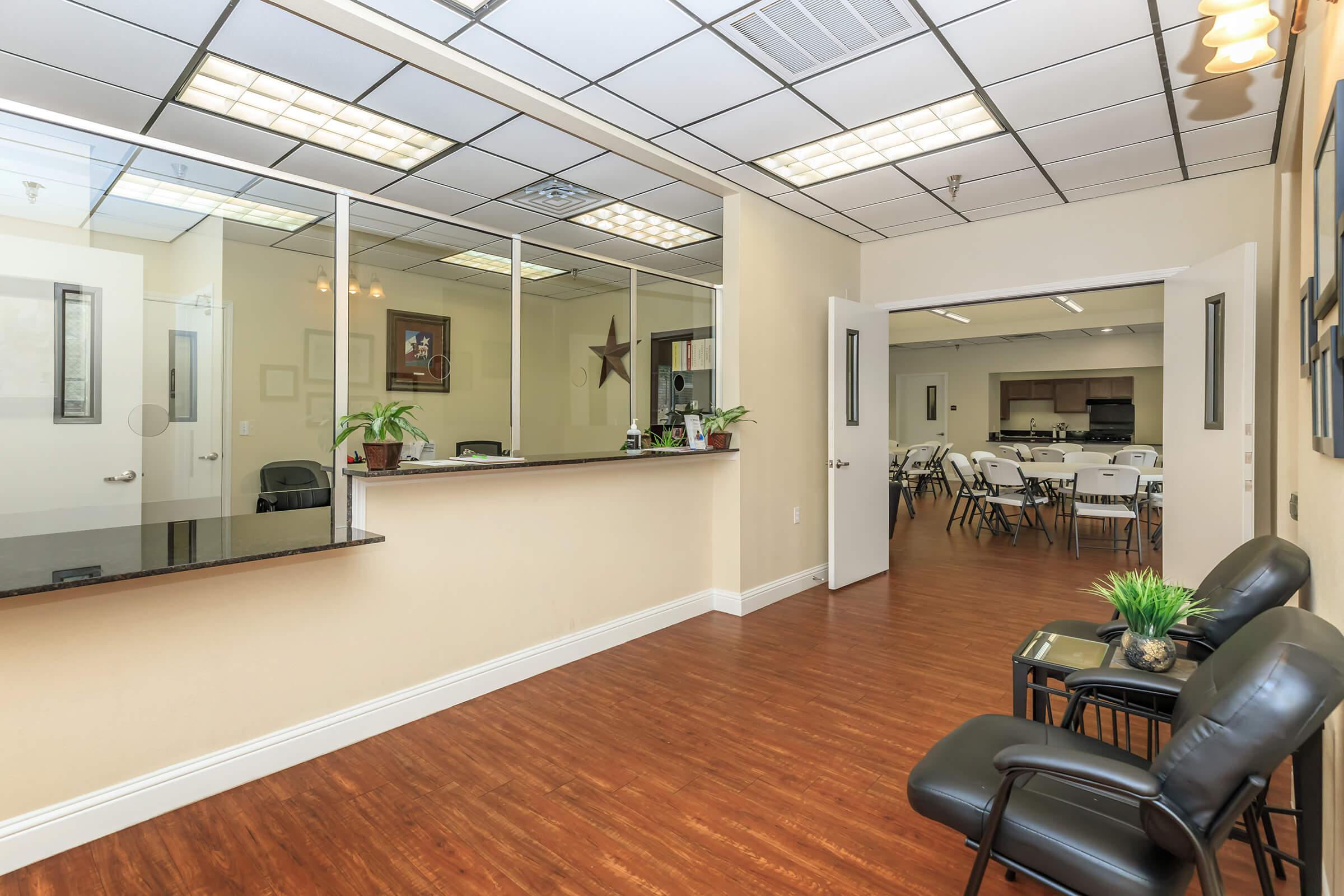 a room filled with furniture and a large window