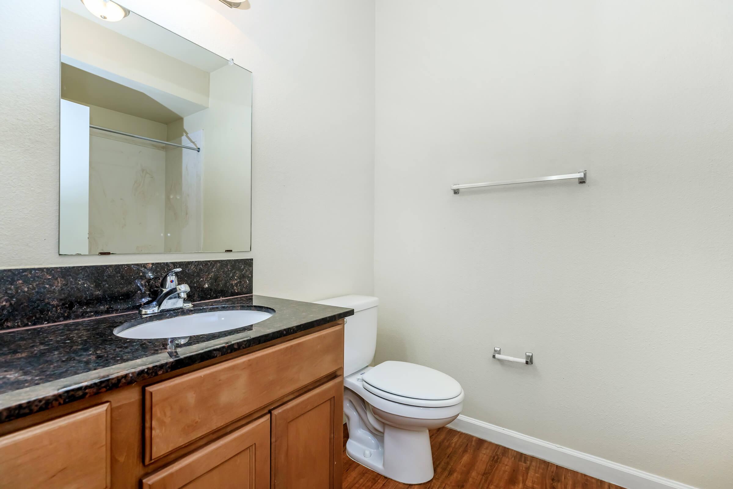 a kitchen with a sink and a mirror