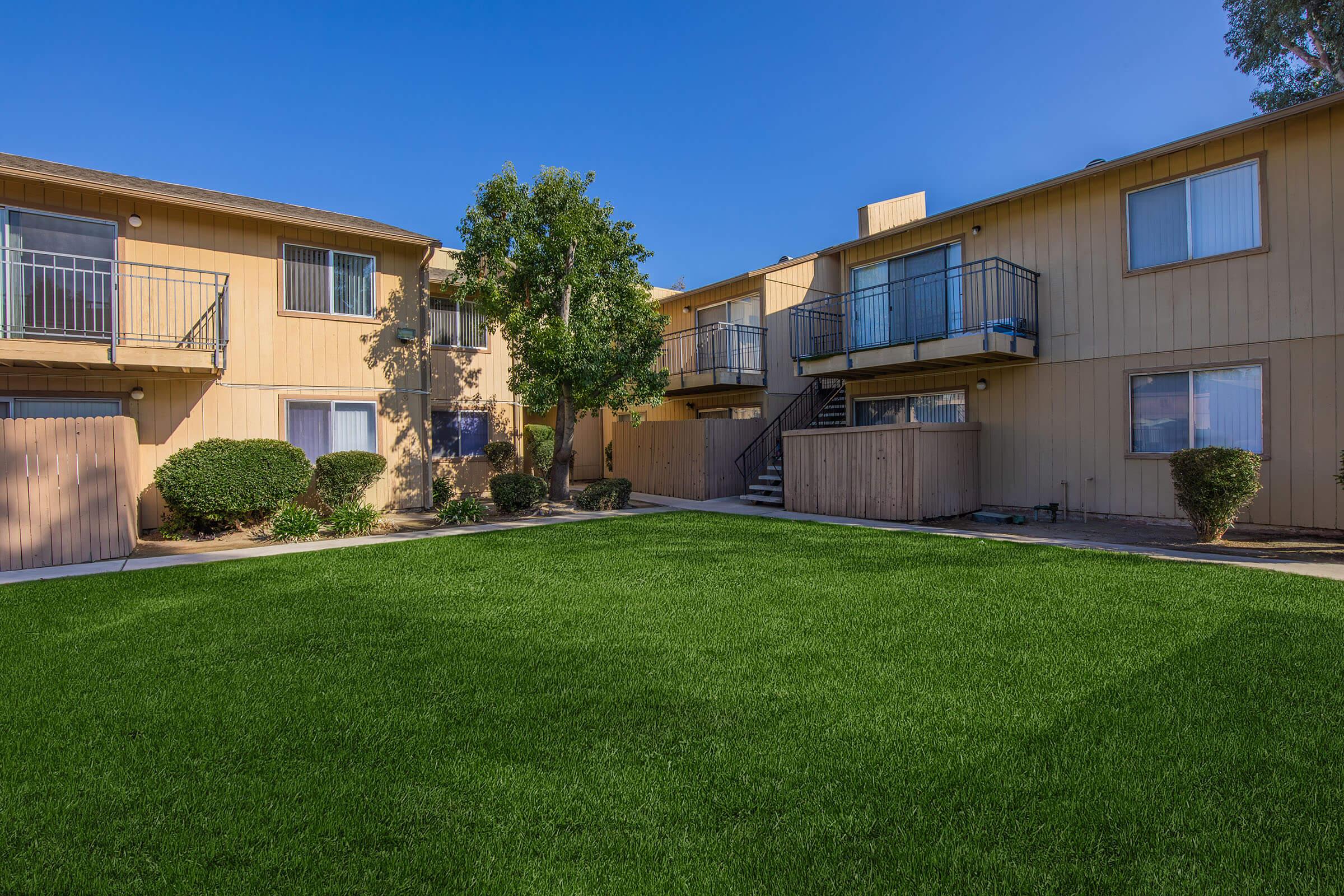 a large lawn in front of a house