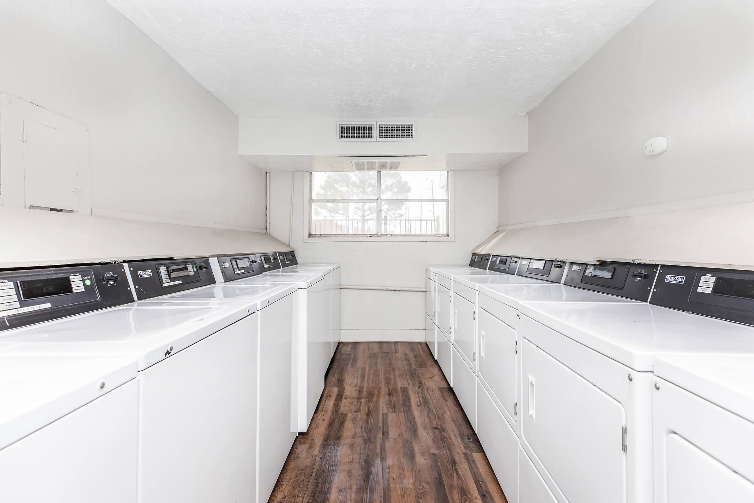 a kitchen with wooden cabinets