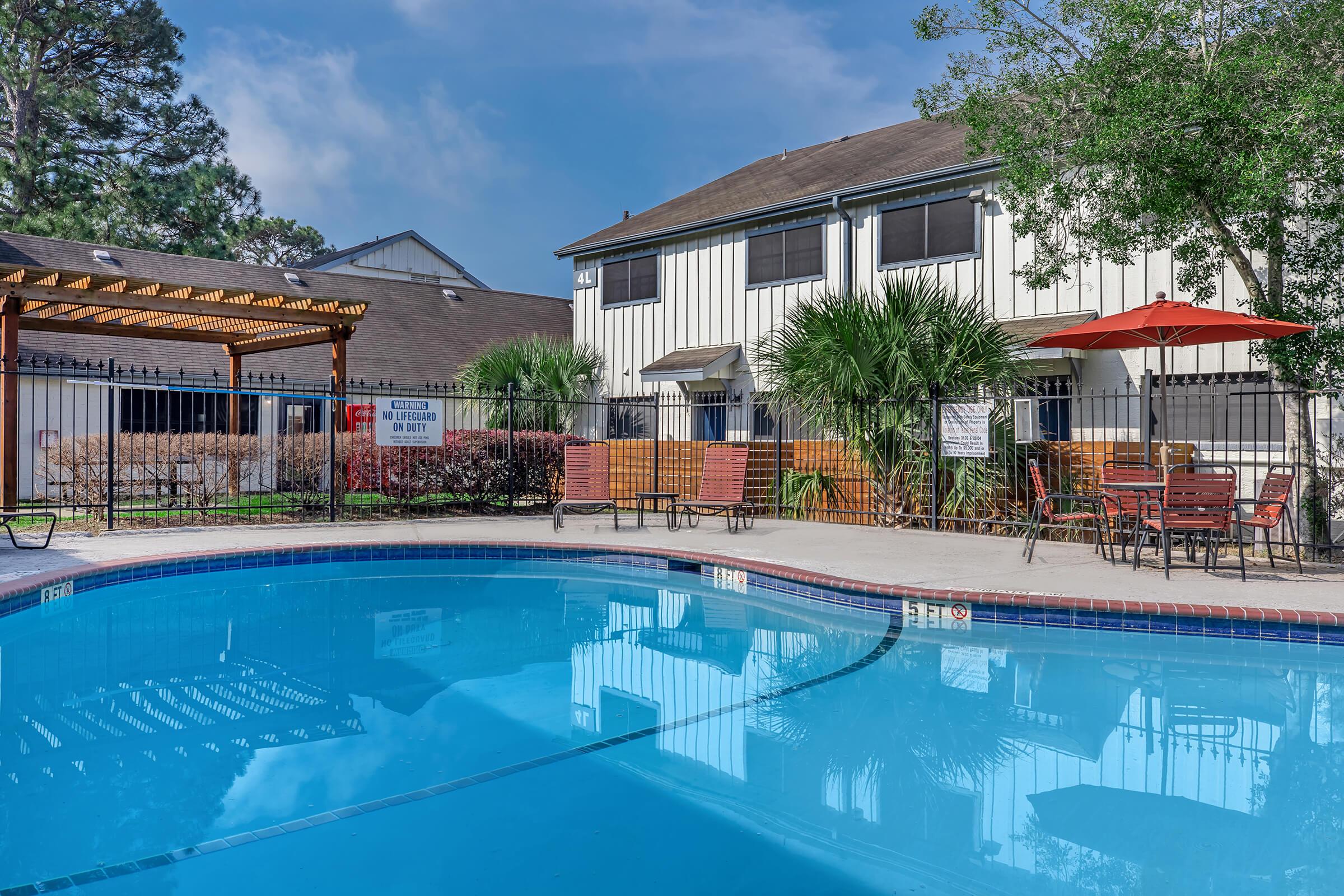 a house with a large pool of water