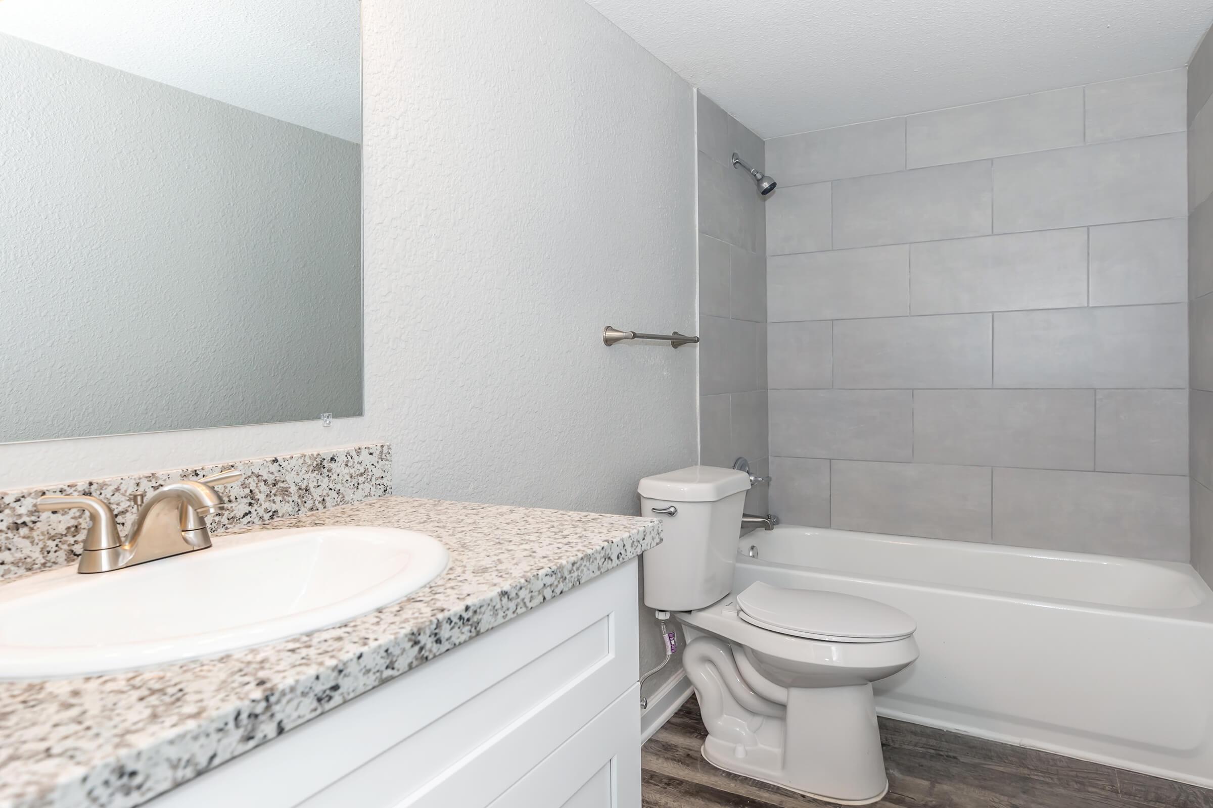 a room with a sink and a bath tub