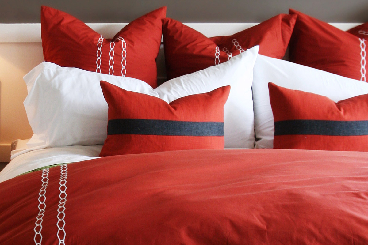 a bed with a red blanket