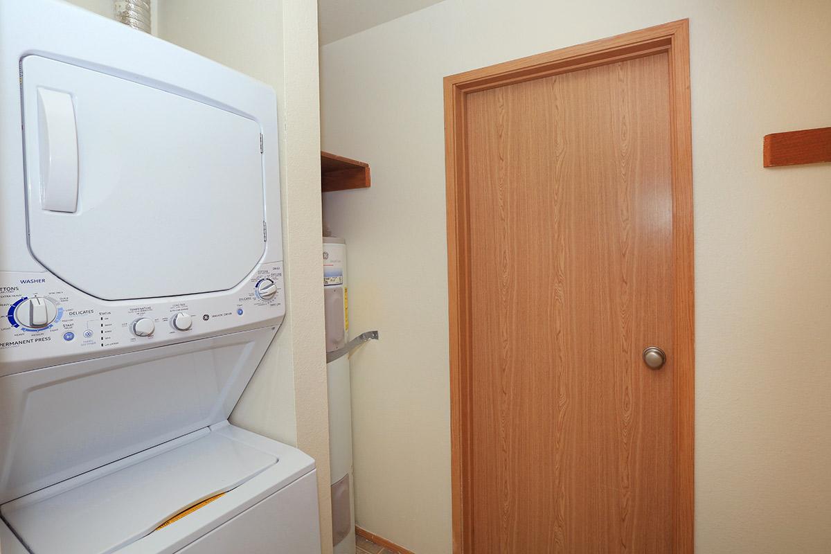 a microwave oven sitting on top of a wooden door
