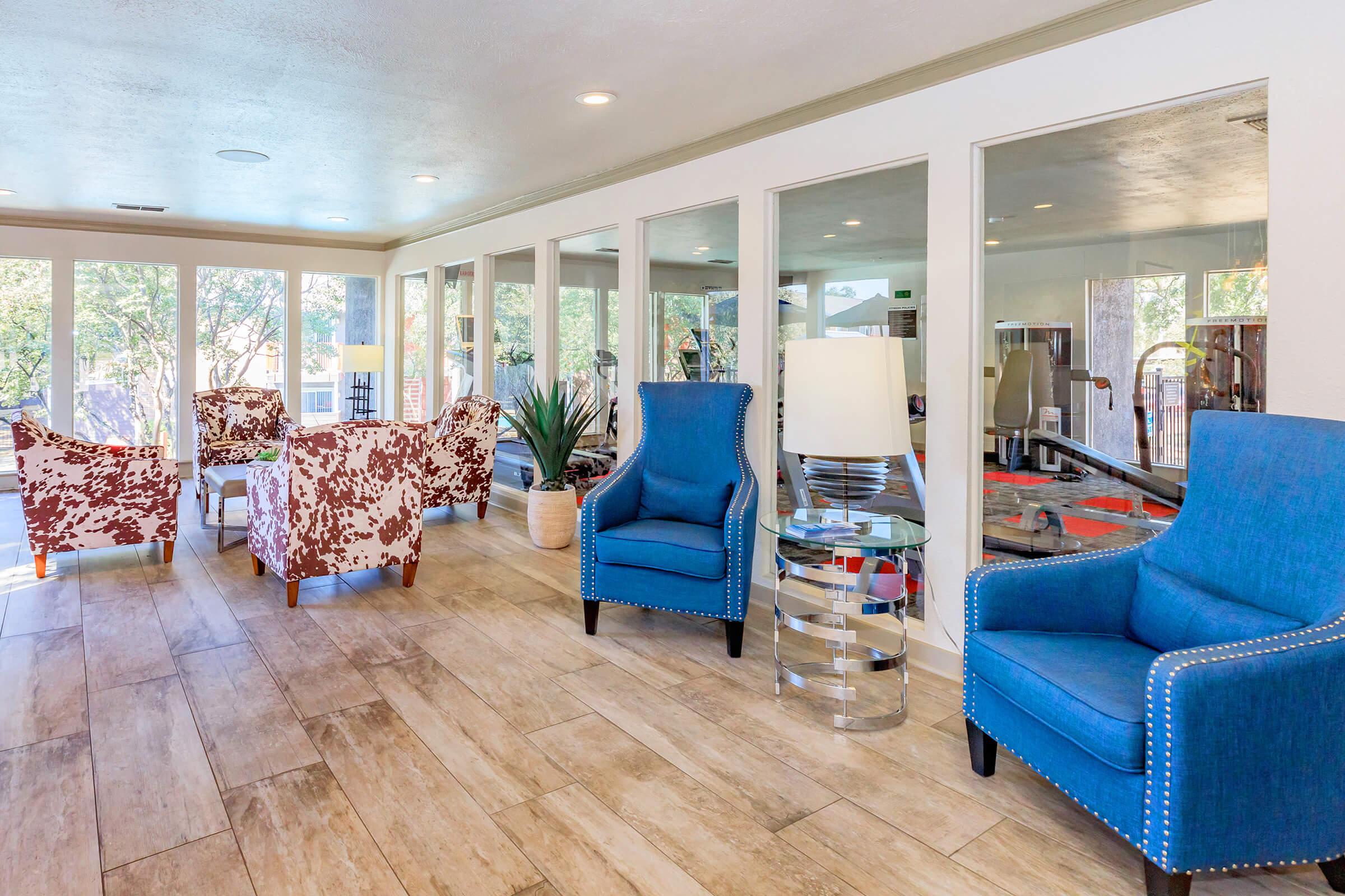 a living room filled with furniture and a large window