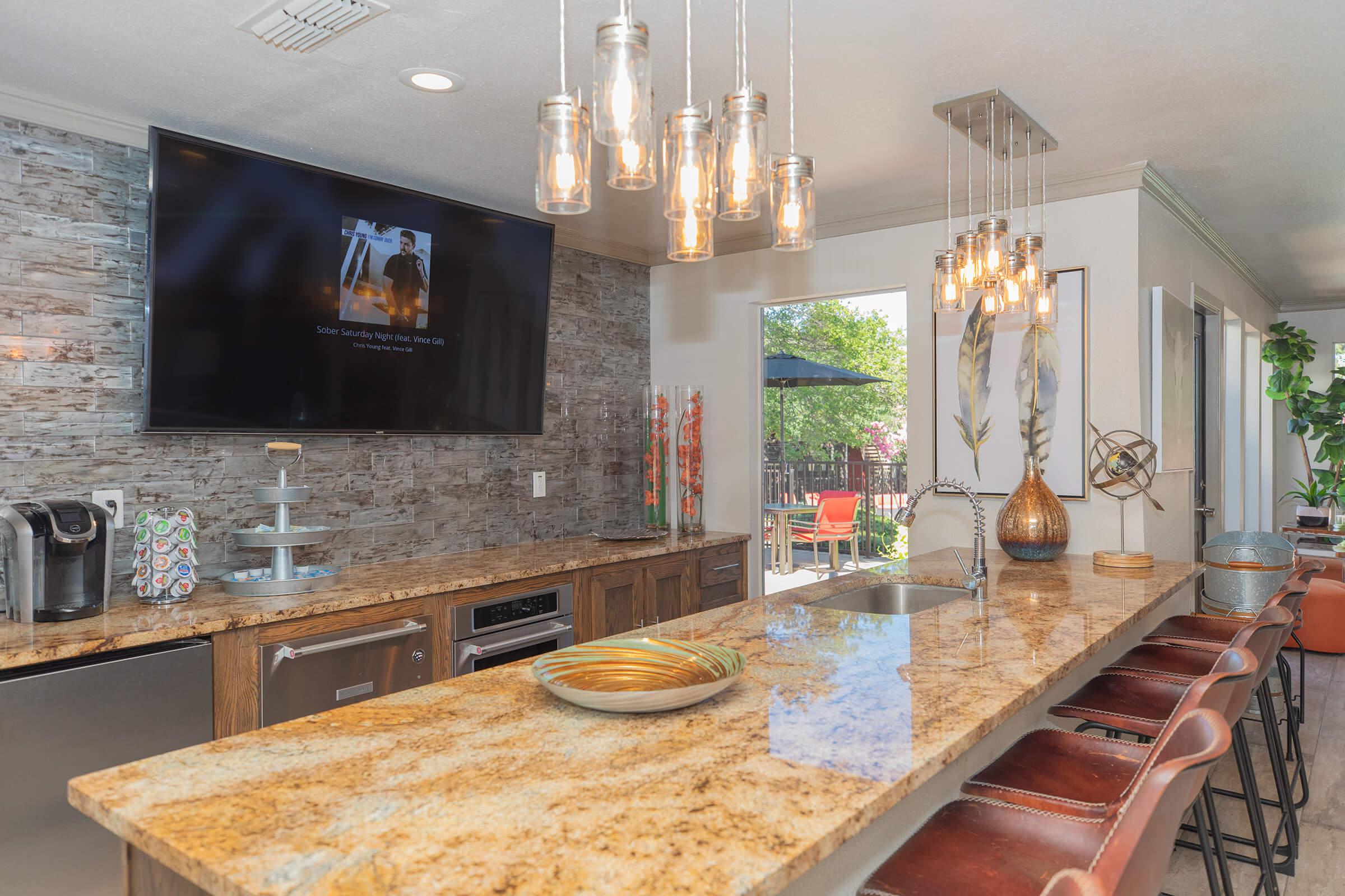 a kitchen with wooden cabinets and a fireplace