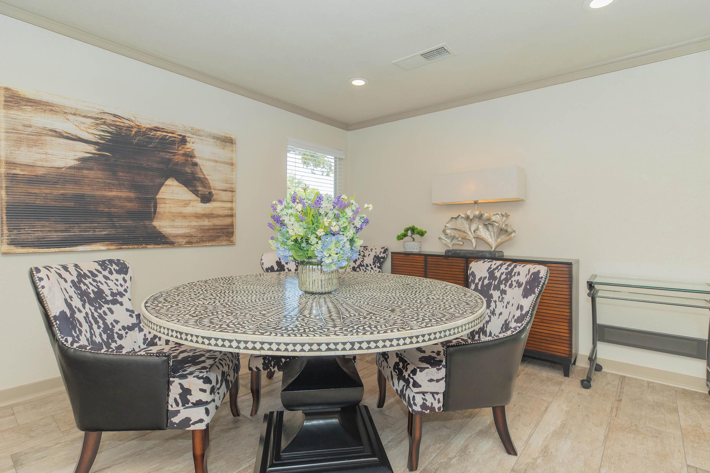 a living room filled with furniture and a rug