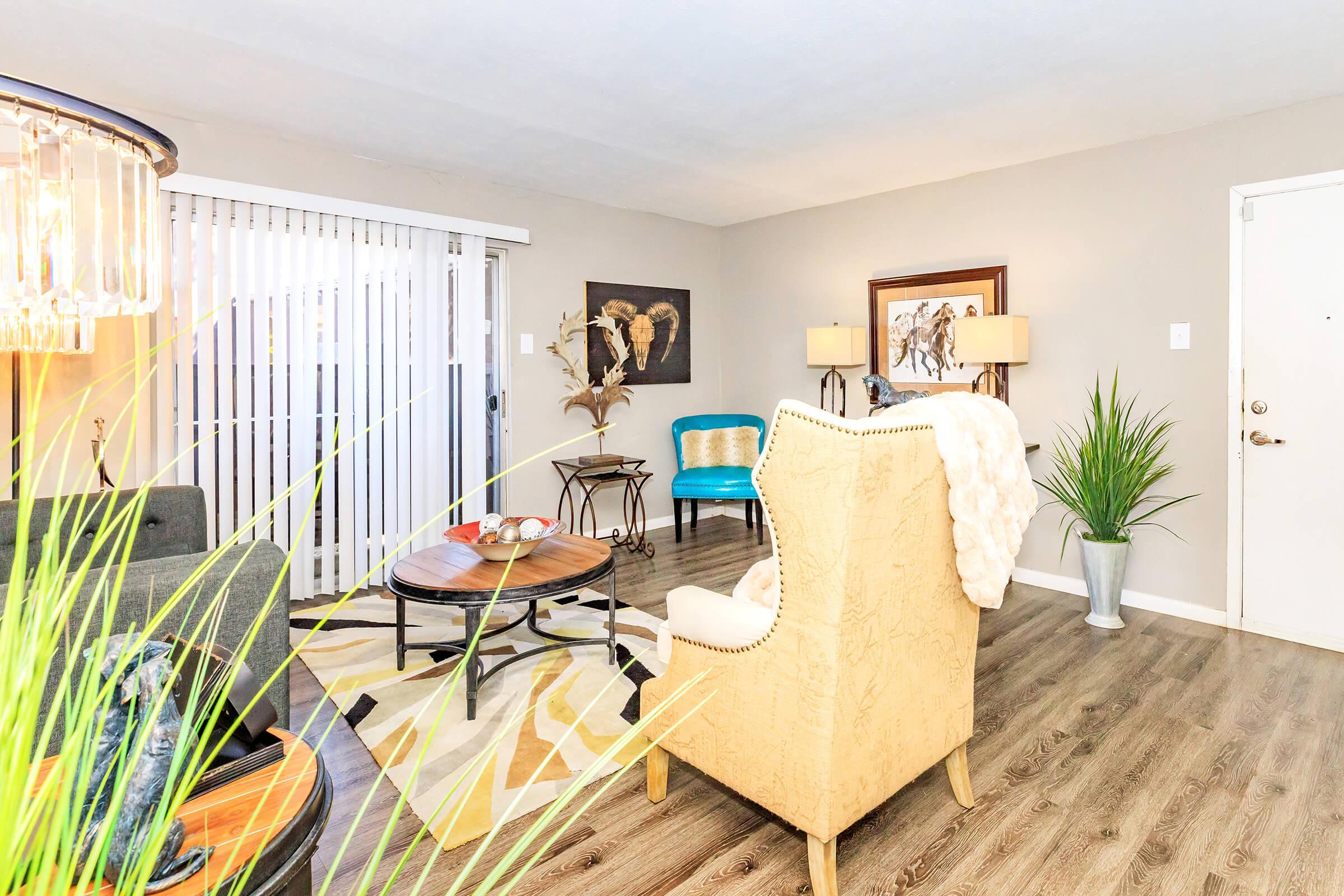 a living room filled with furniture and a flat screen tv