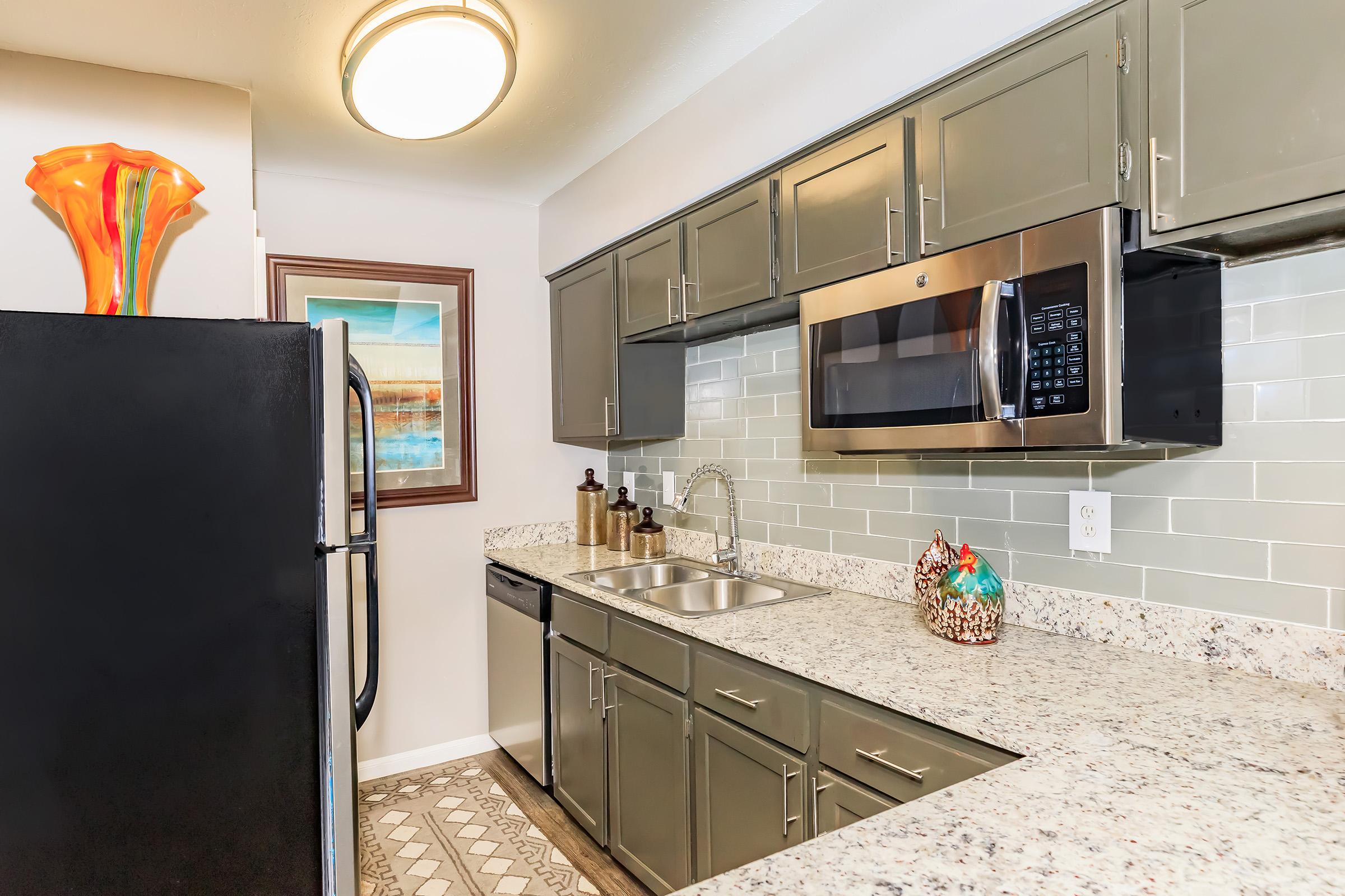 a large kitchen with stainless steel appliances