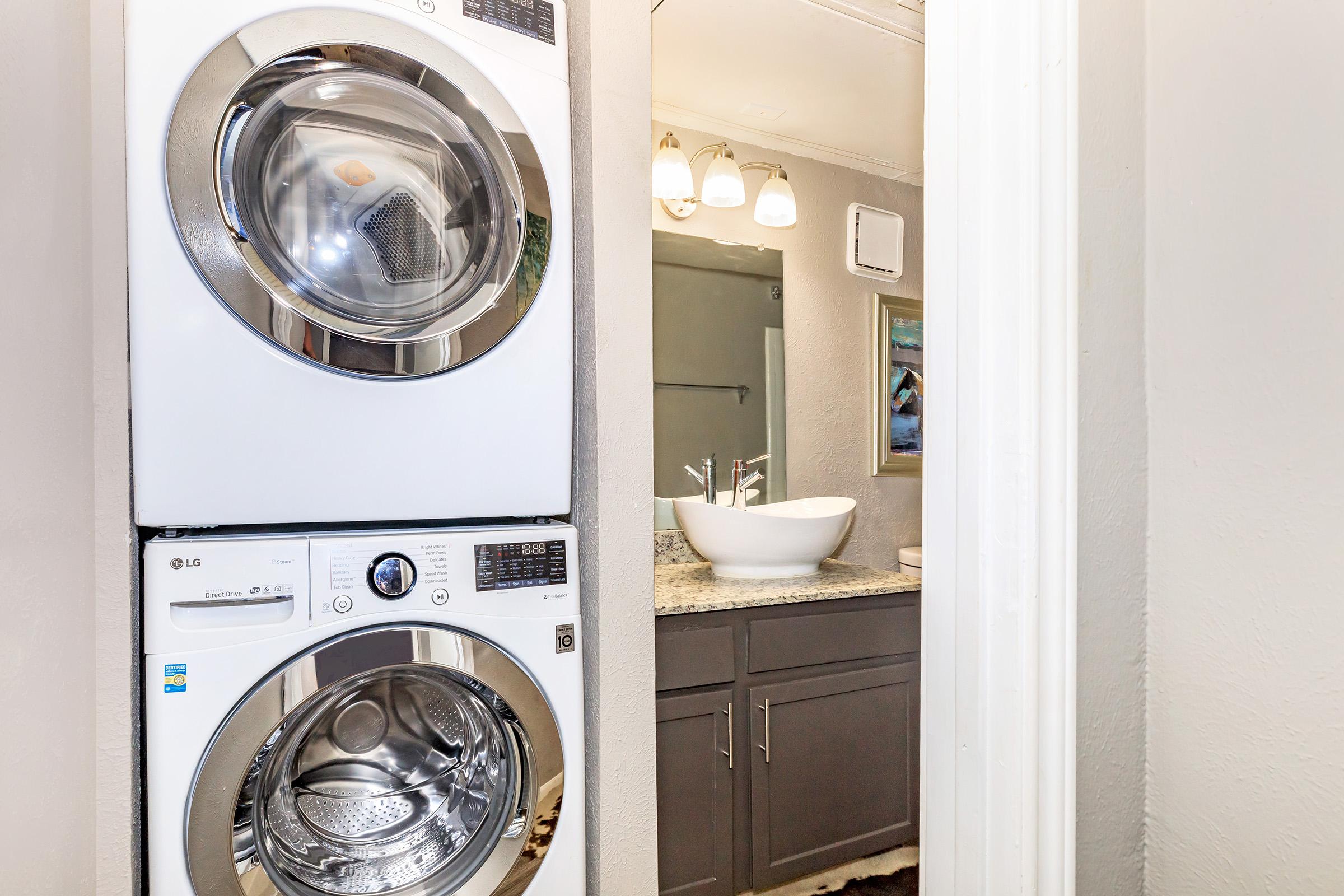 a kitchen with a sink and a mirror