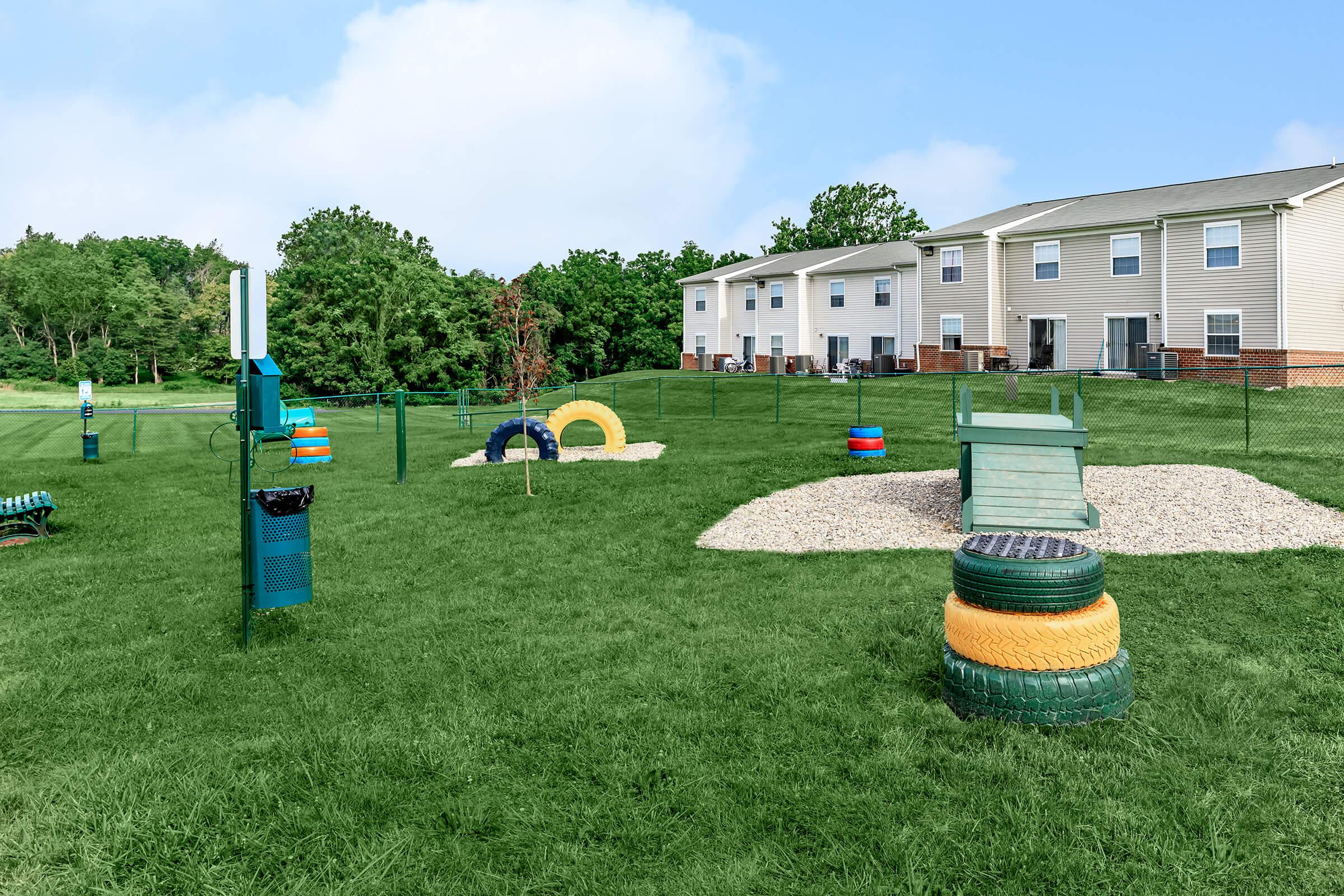 a group of lawn chairs sitting on top of a grass covered field