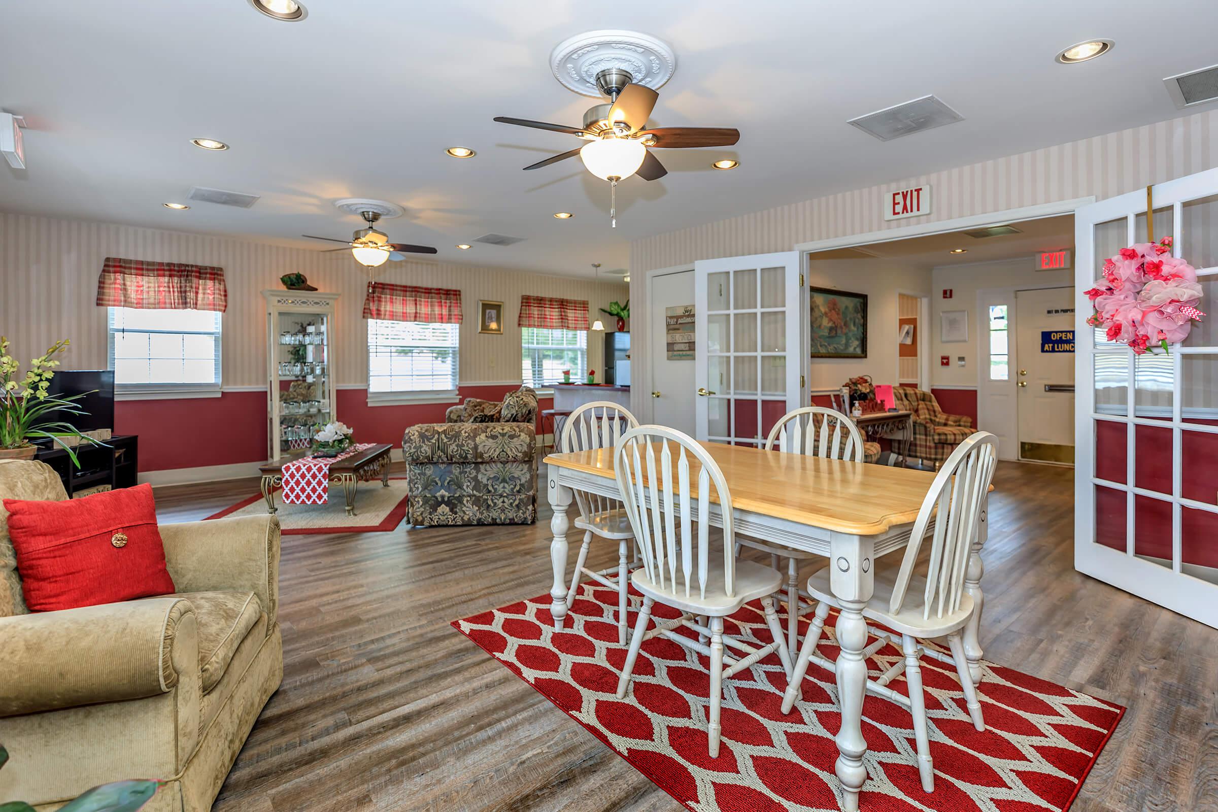 a living room filled with furniture and a rug