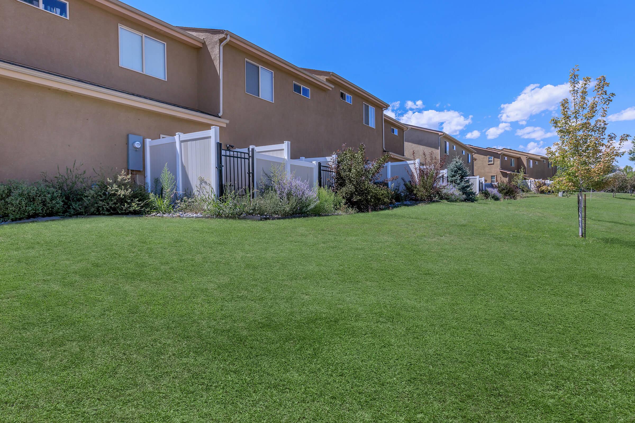 a building with a grassy field