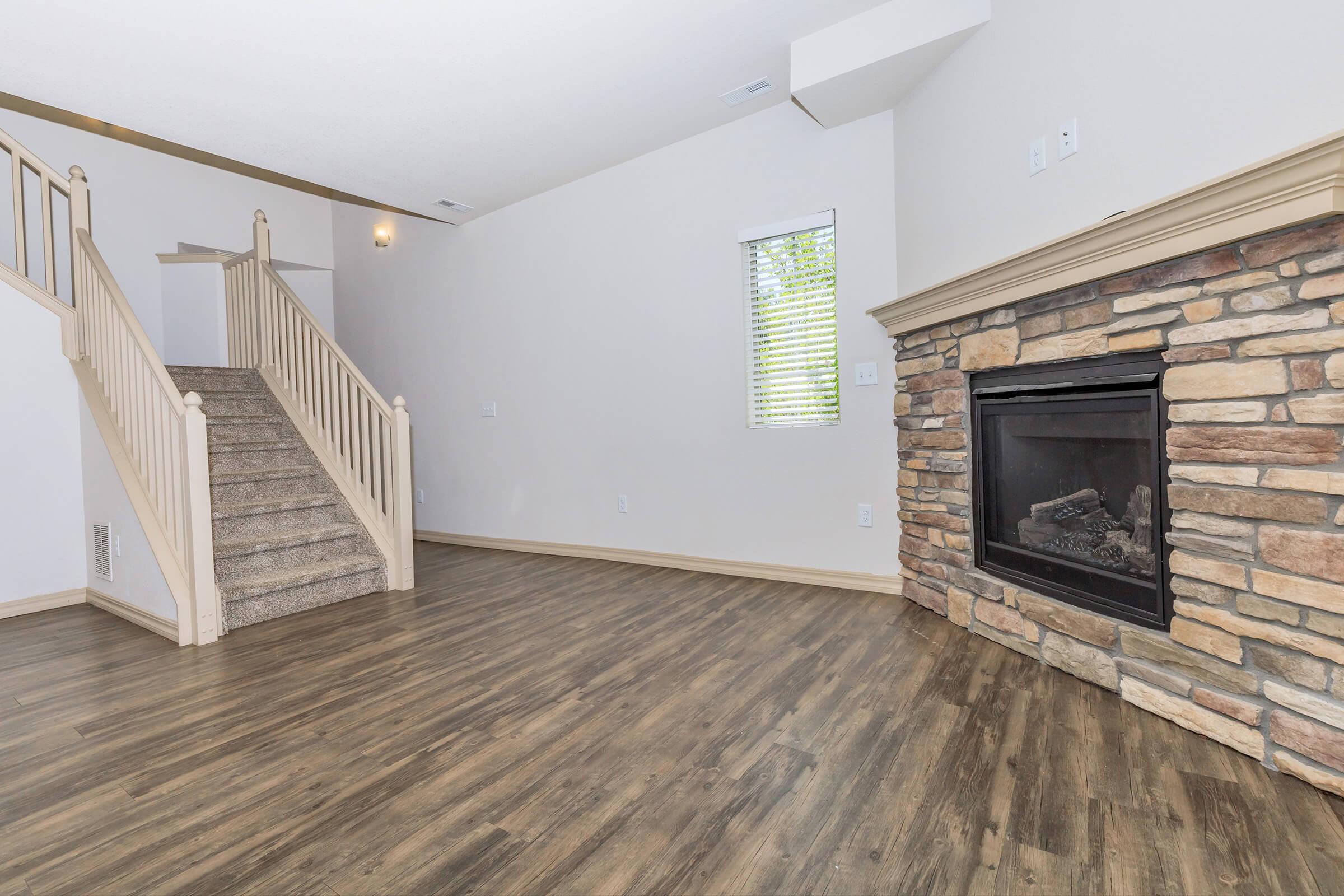 a living room with a brick wall