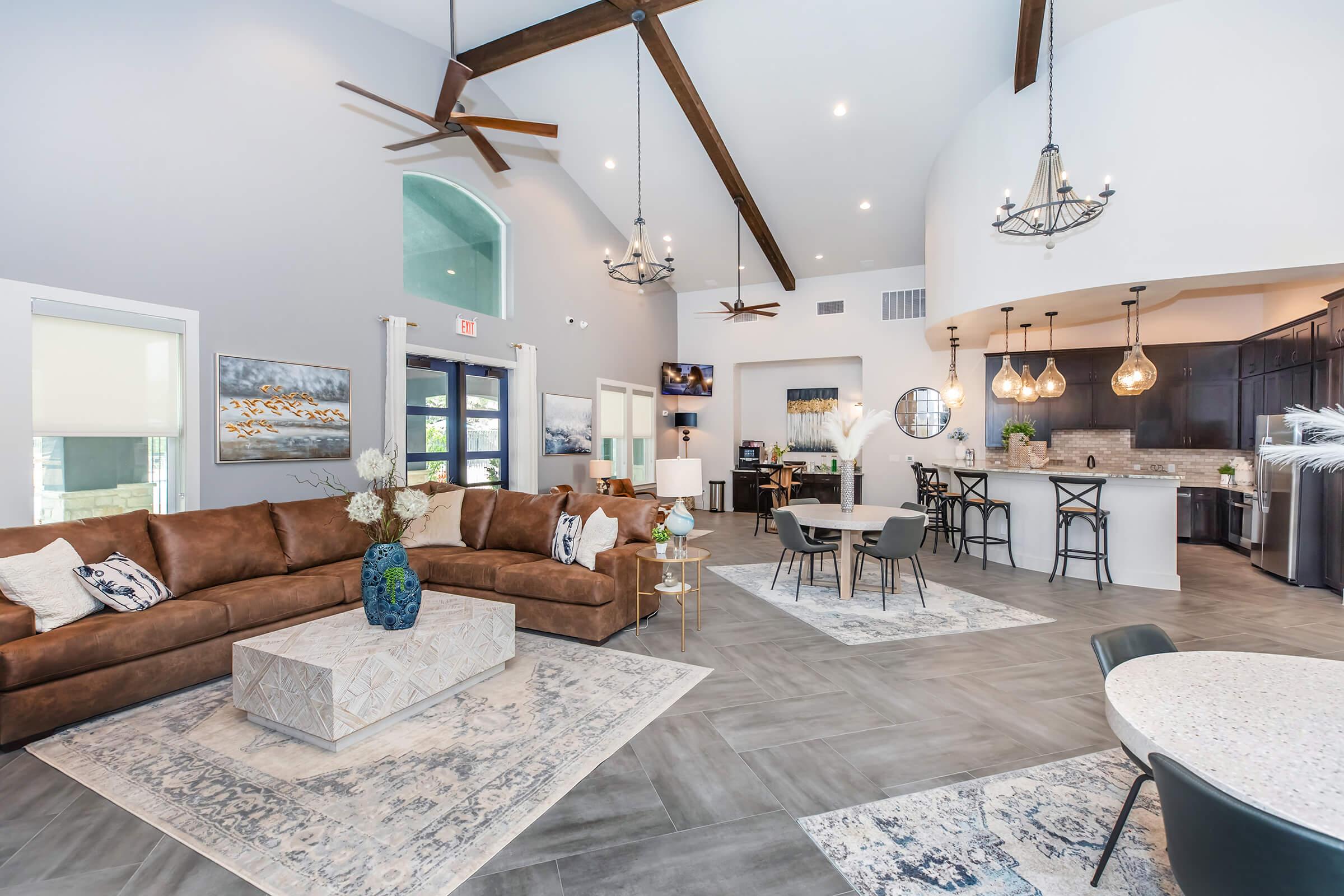 a living room filled with furniture and a table