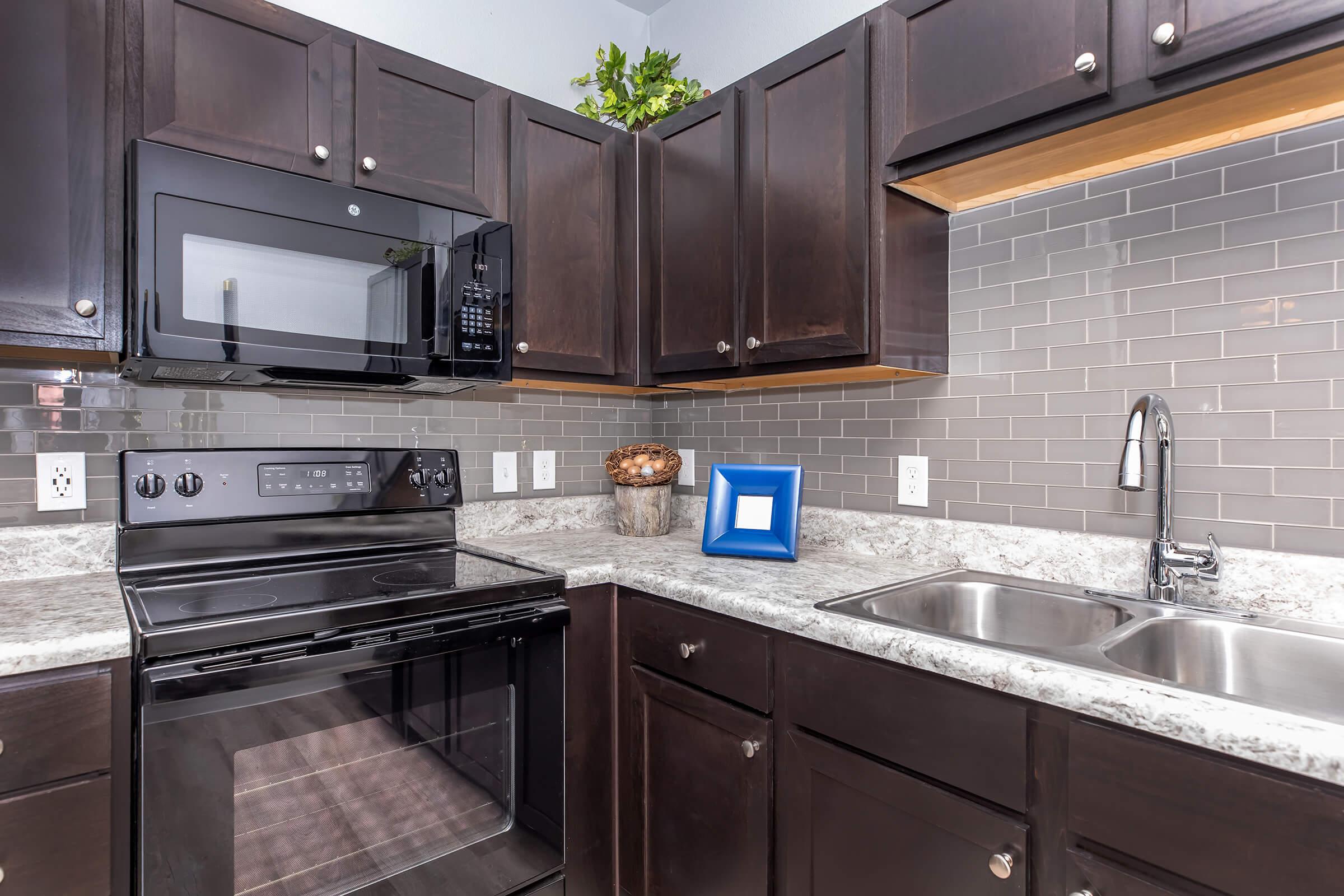 a large kitchen with stainless steel appliances