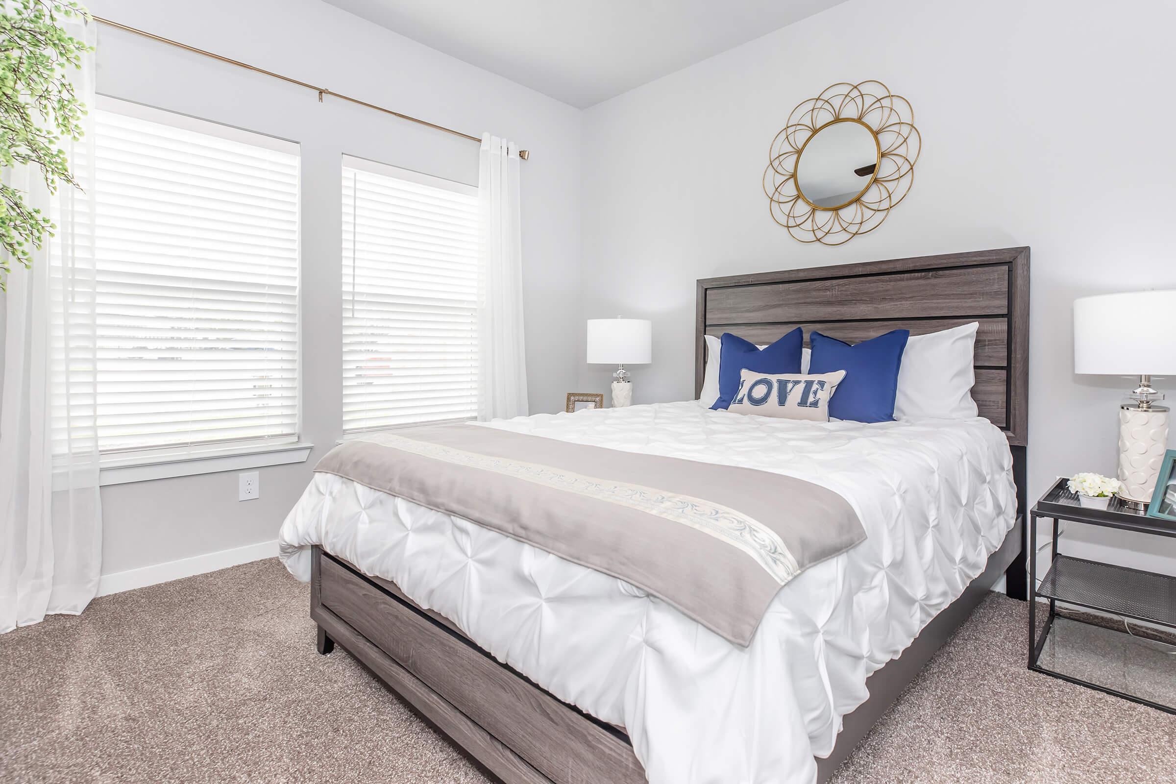 a bedroom with a large bed in a hotel room