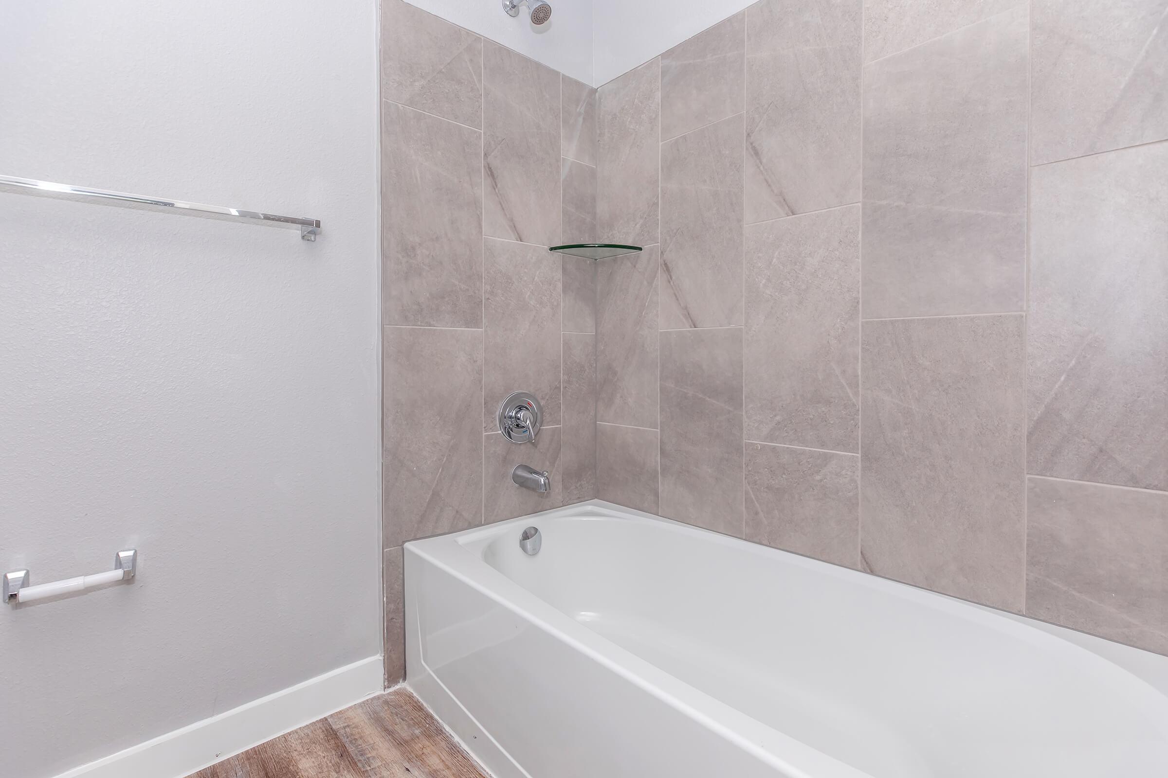 a room with a sink and a bath tub