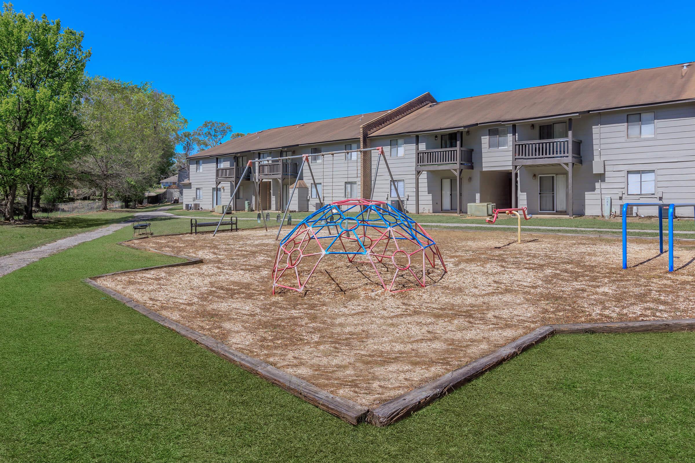 a house with a lawn in front of a building