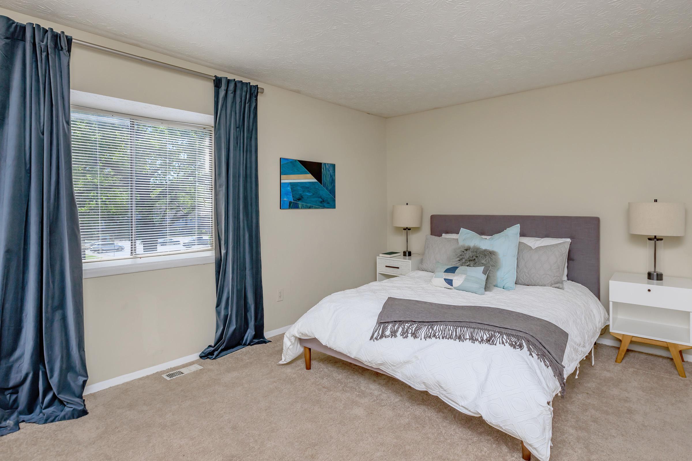 a bedroom with a bed in a hotel room