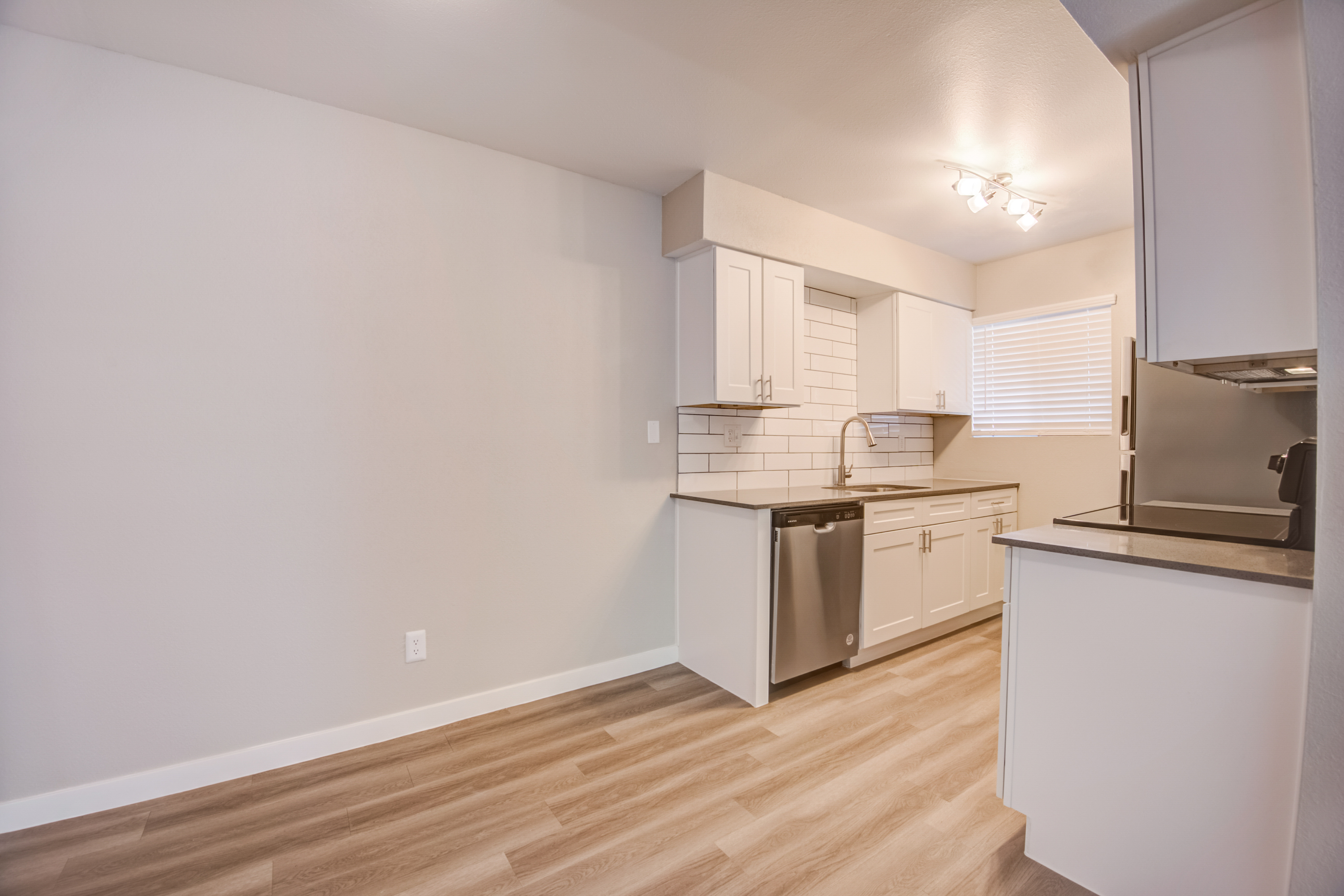a kitchen with a wood floor