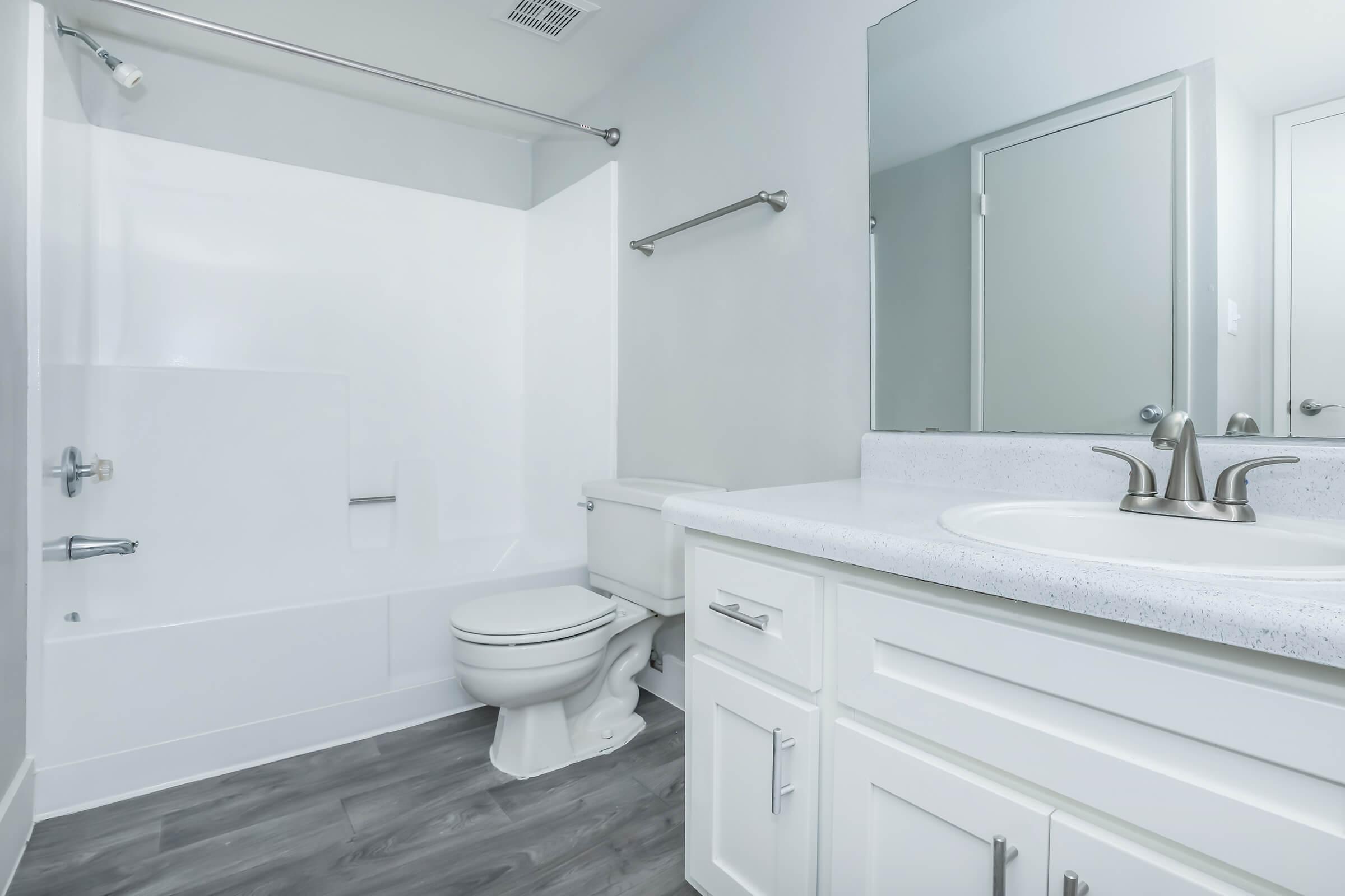 a room with a sink and a mirror