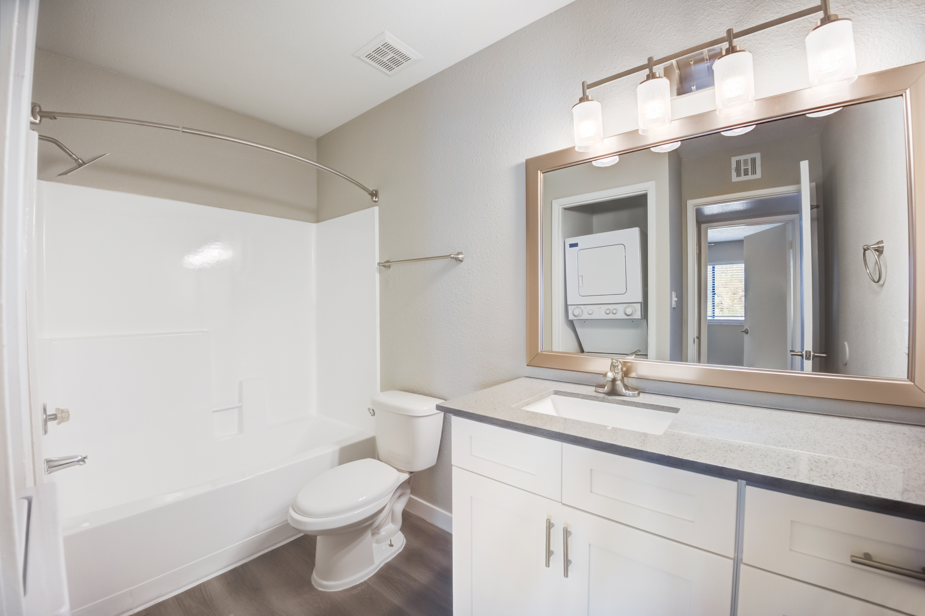 a kitchen with a sink and a mirror