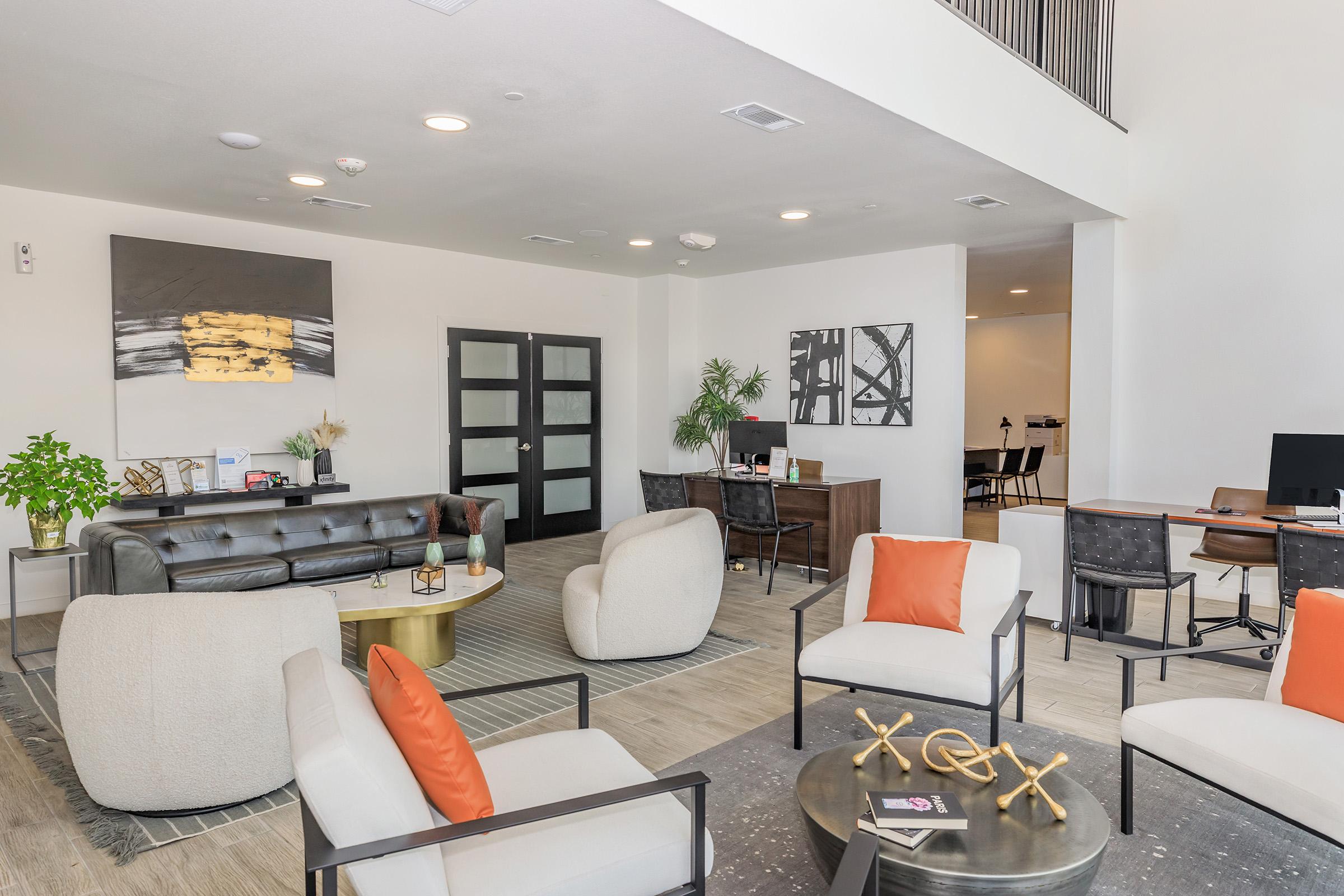 a living room filled with furniture and a flat screen tv