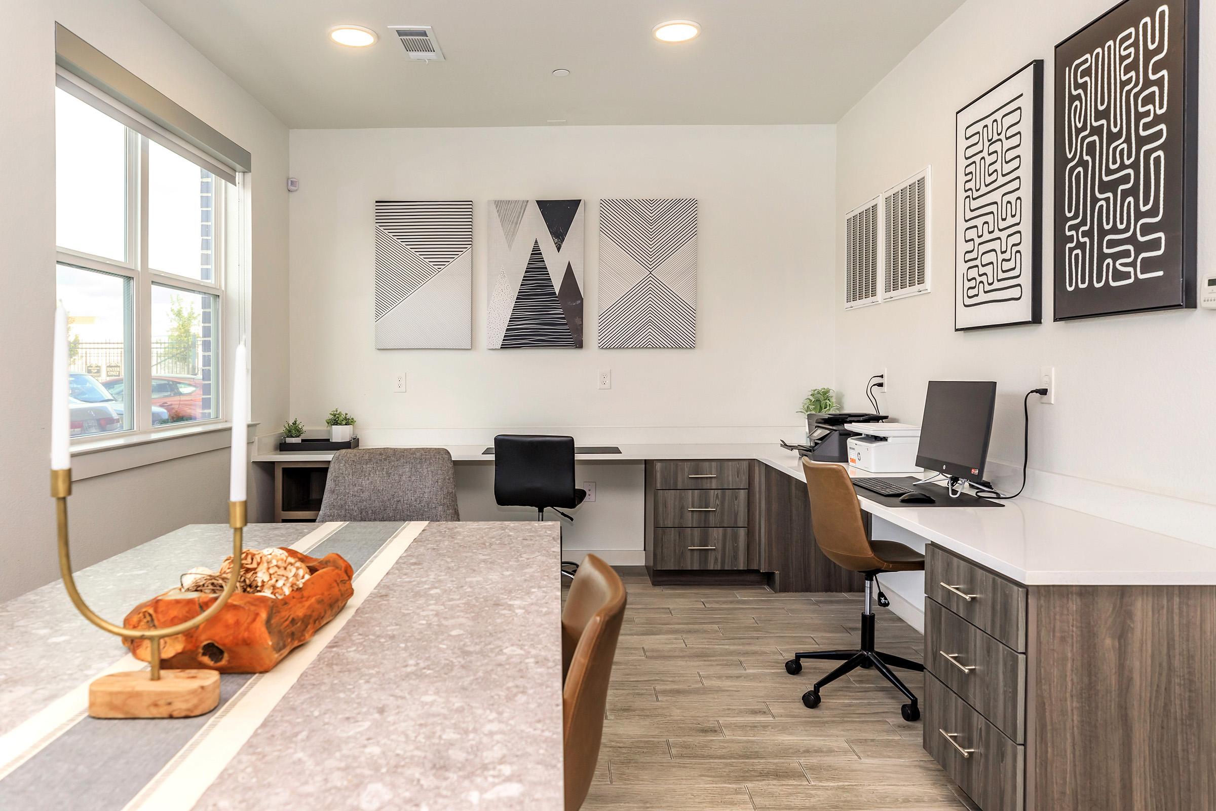 a living room filled with furniture and a large window