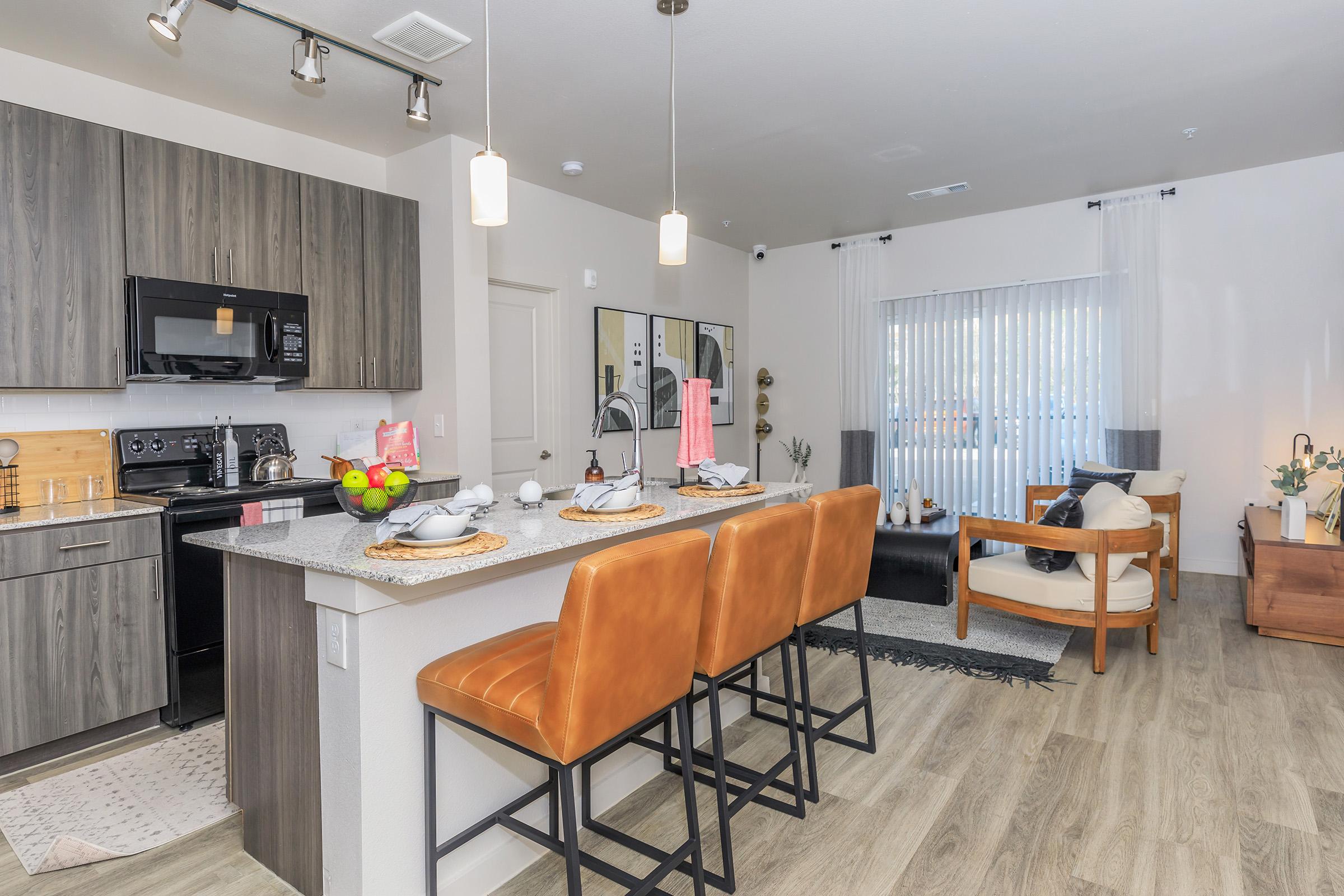 a kitchen with a table in a room