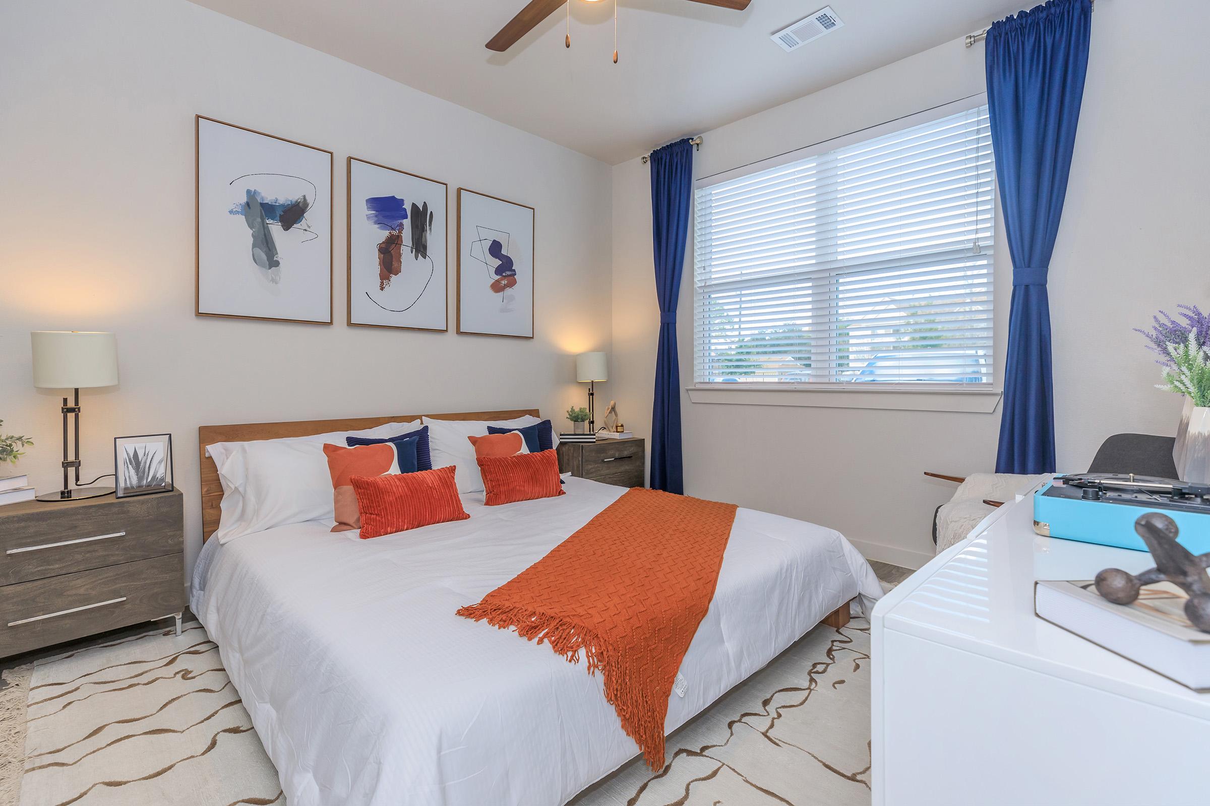 a bedroom with a large bed in a hotel room