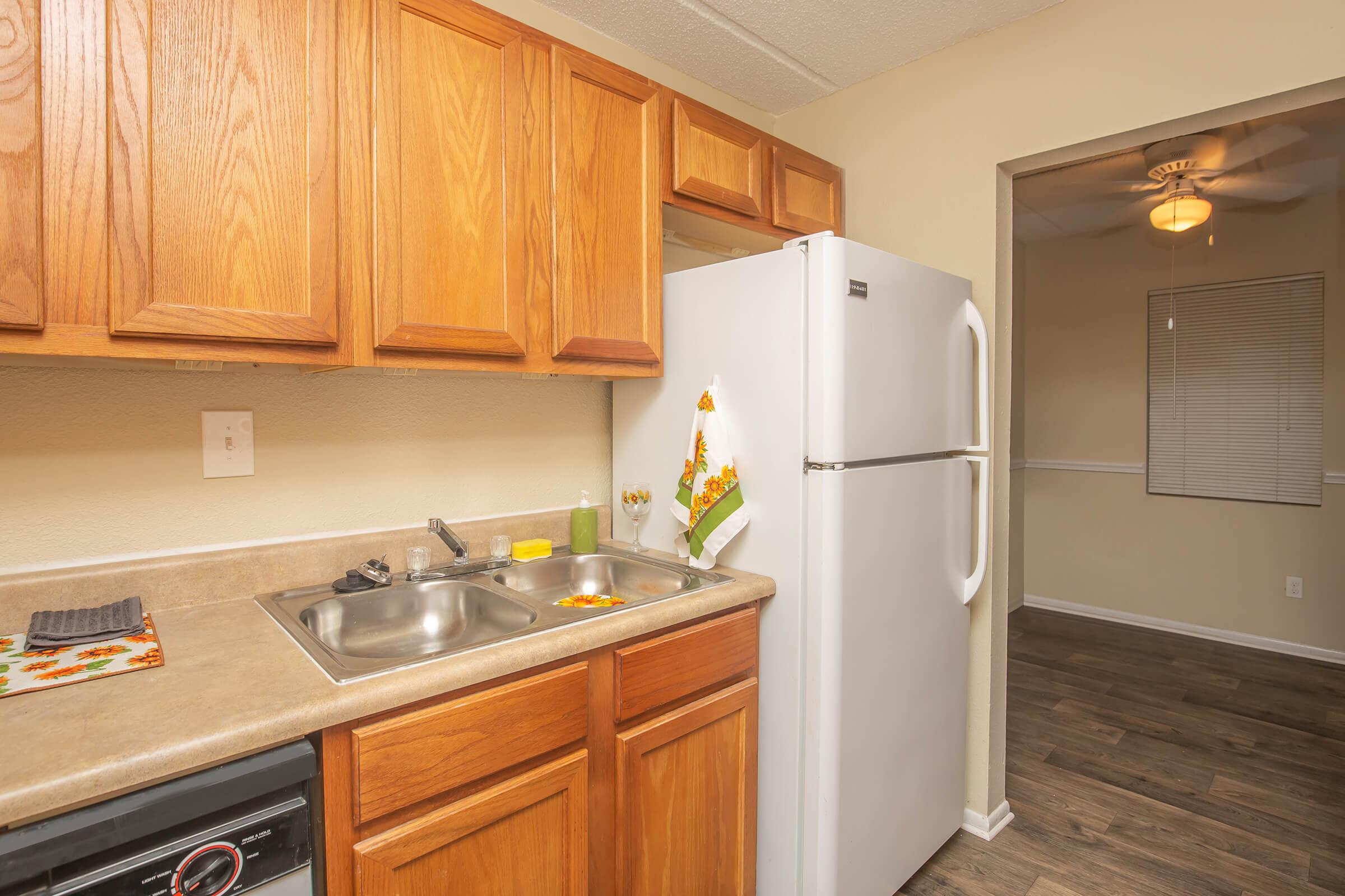 a kitchen with a sink and a refrigerator