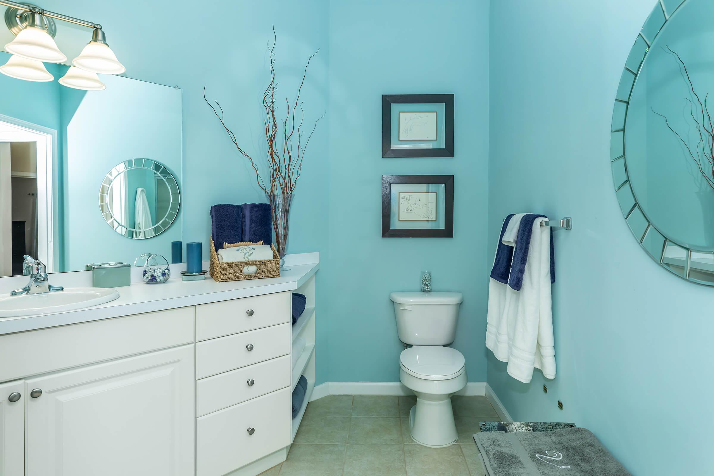 a bedroom with a large mirror