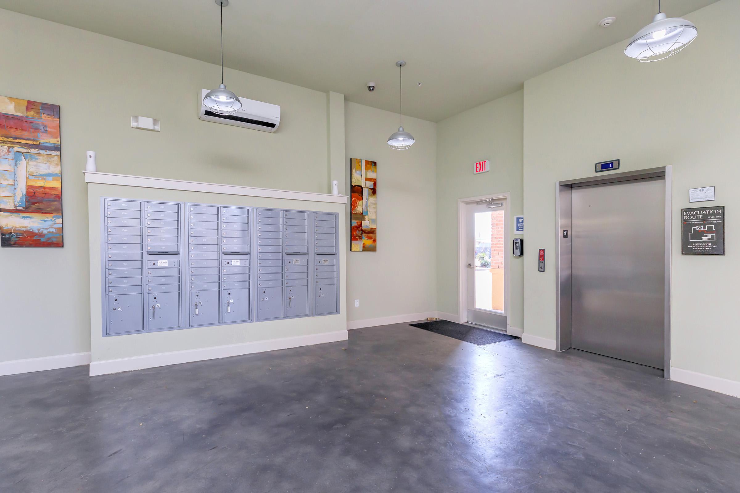 a large kitchen with stainless steel refrigerator in a room