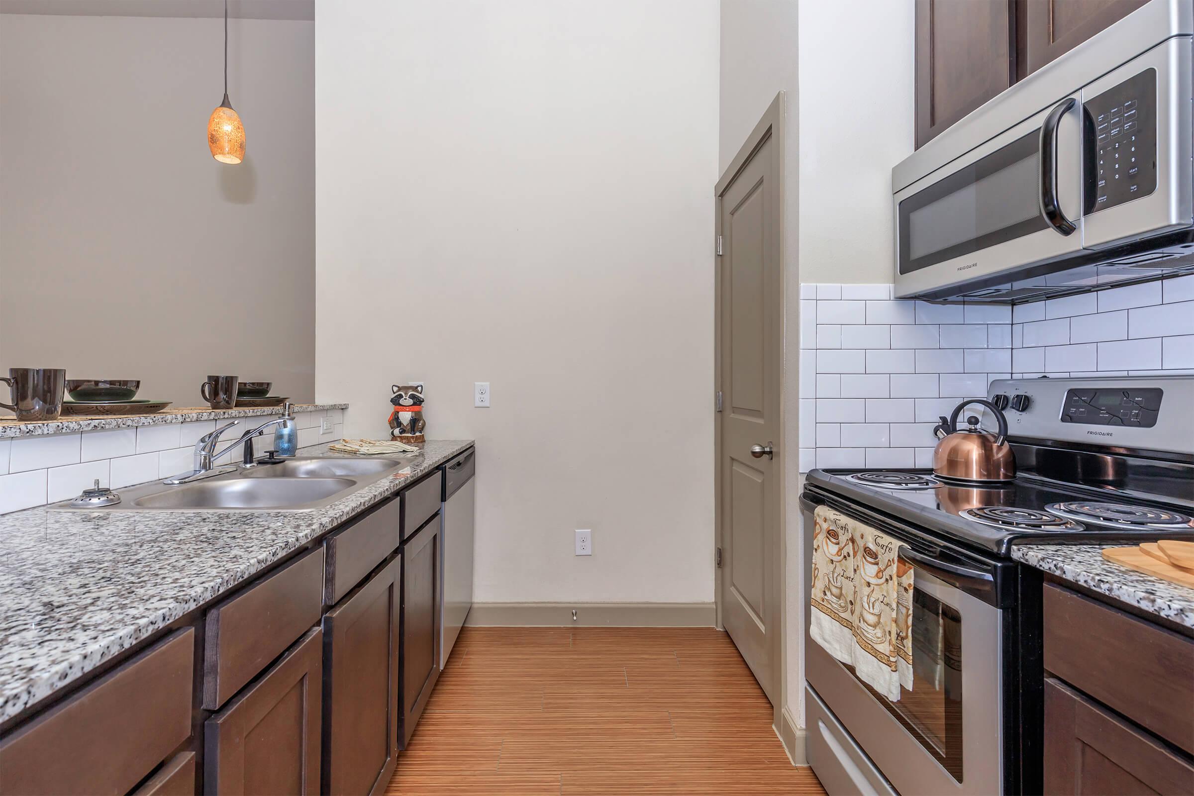 a kitchen with a stove and a sink